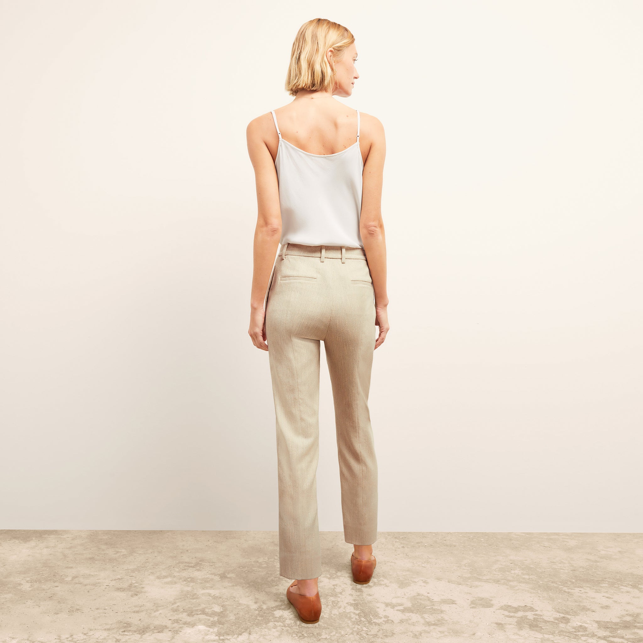 back image of a woman wearing the pearl pant in ivory