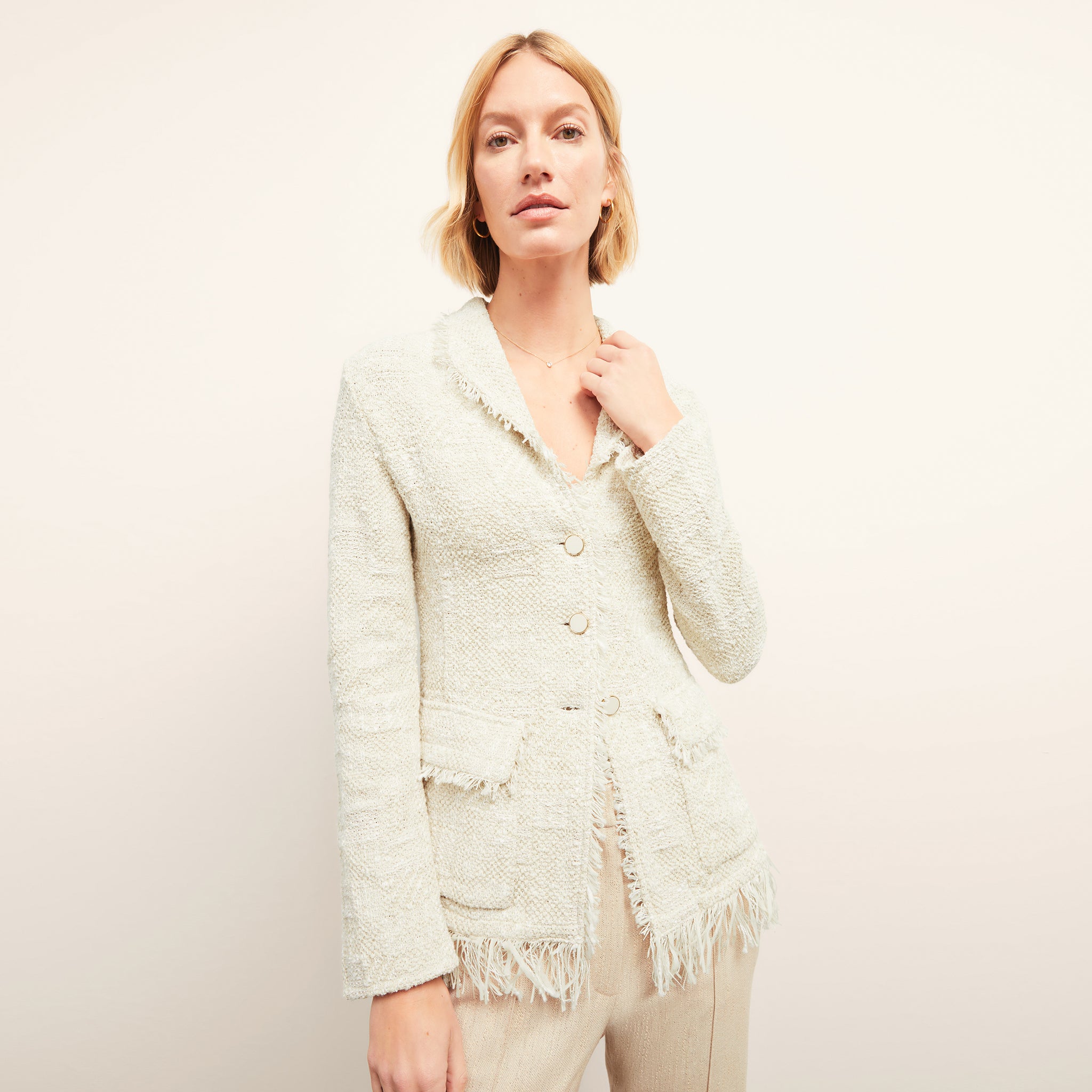 front image of a woman wearing the porter jacket in ivory 