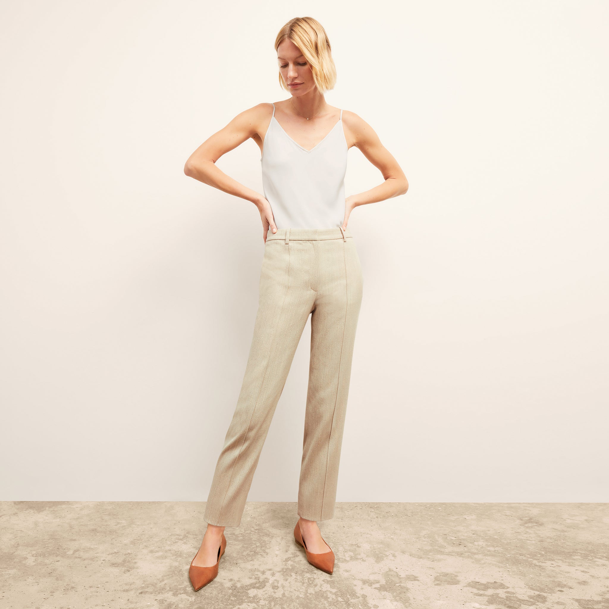 front image of a woman wearing the pearl pant in ivory 