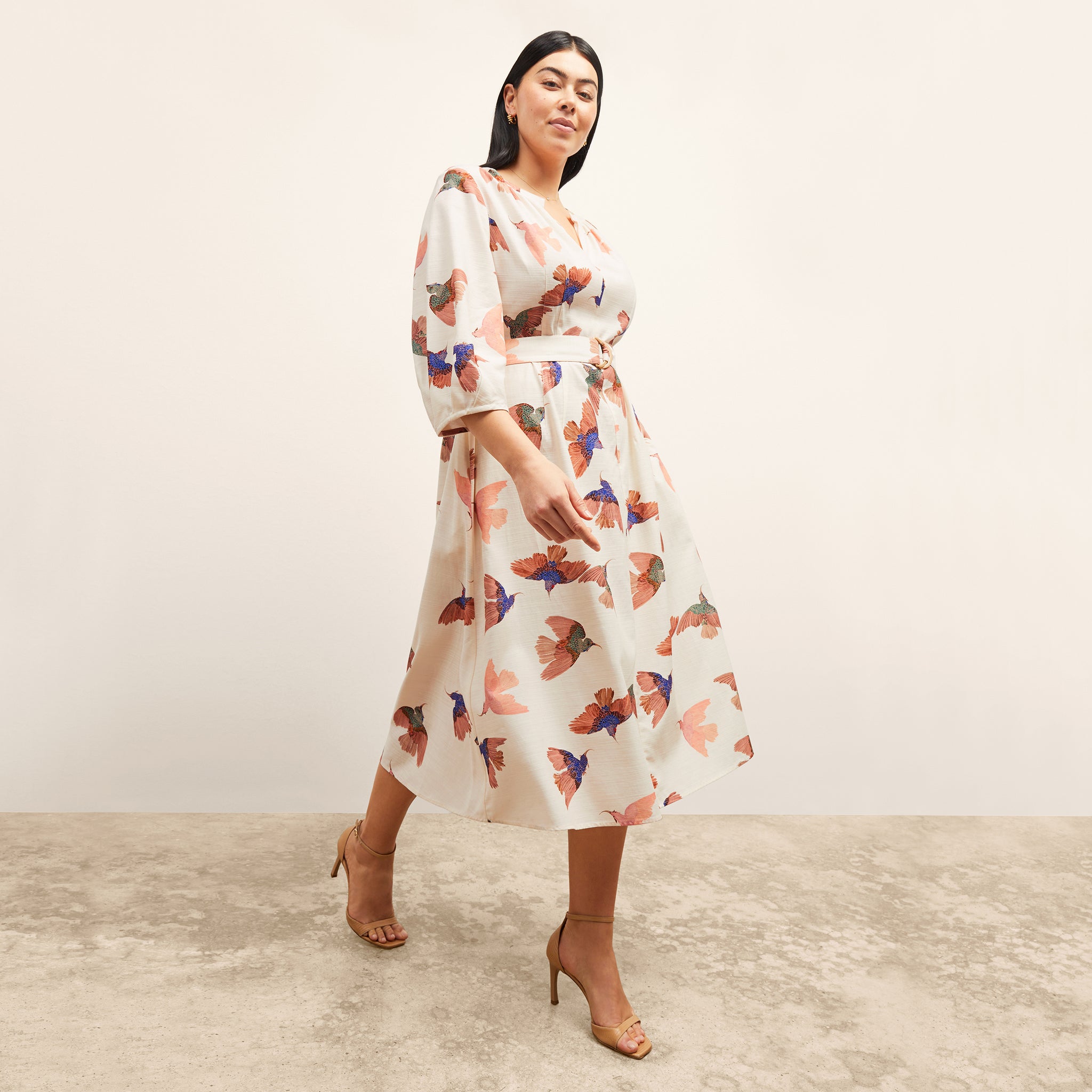 front image of a woman wearing the tessie dress in hummingbird print