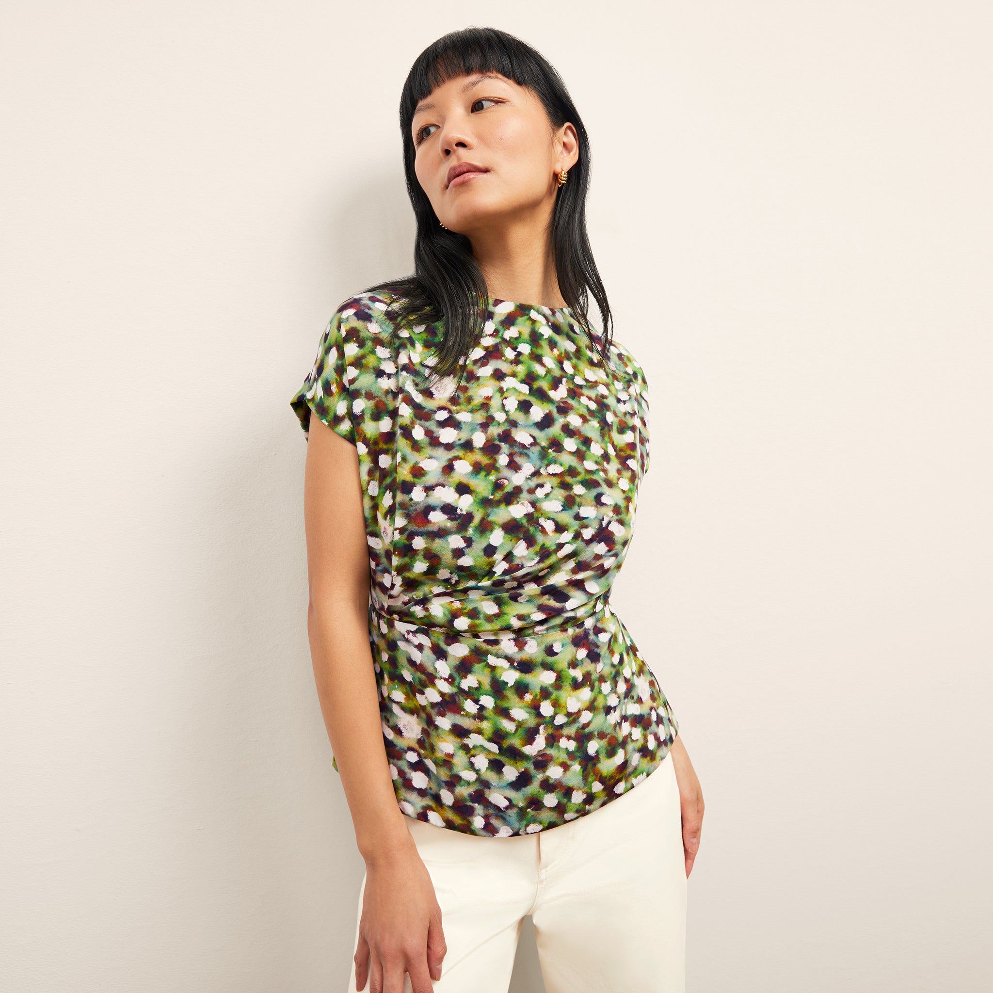 front image of a woman wearing the nejvi top in spotlight print 
