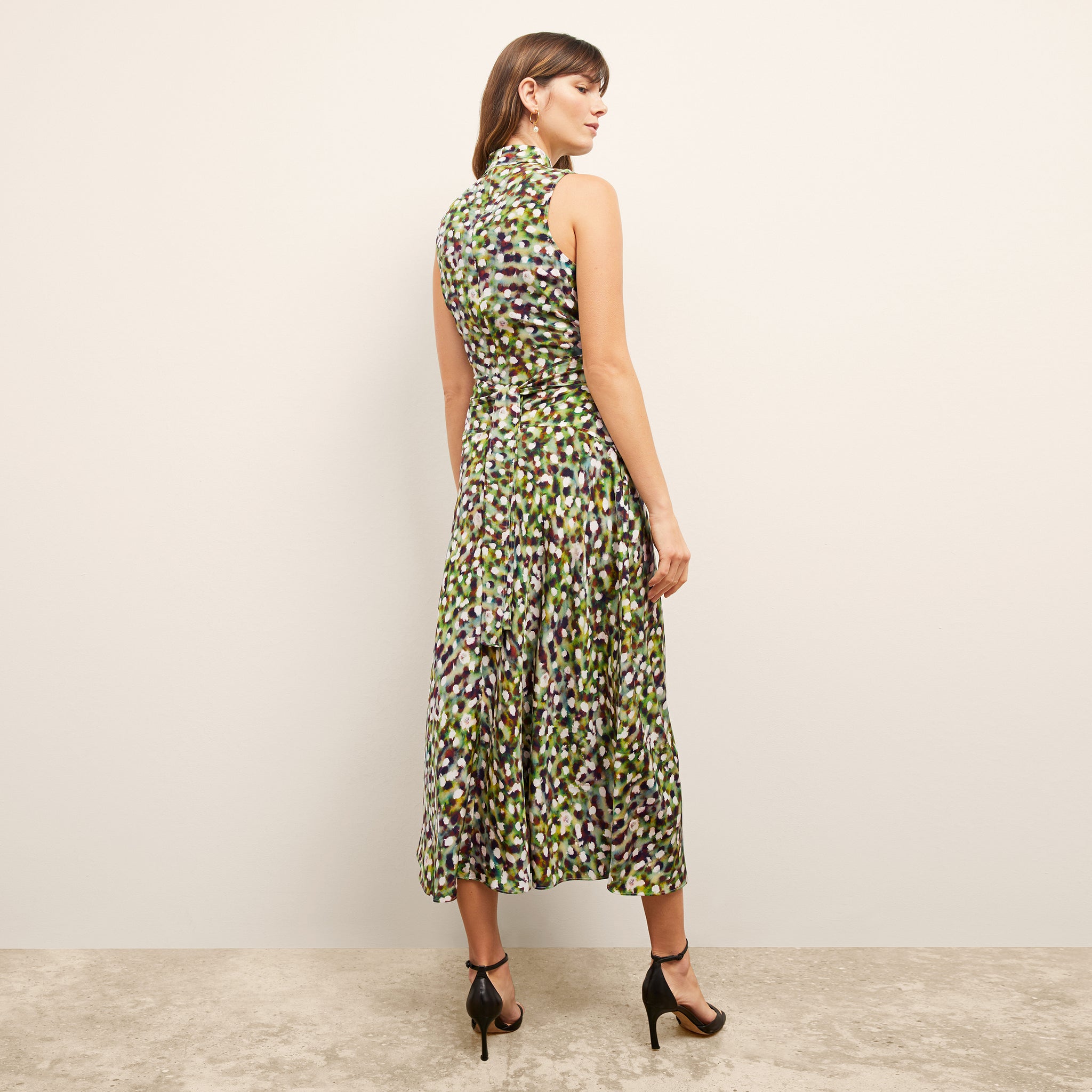 back image of a woman wearing the martina dress in spotlight print