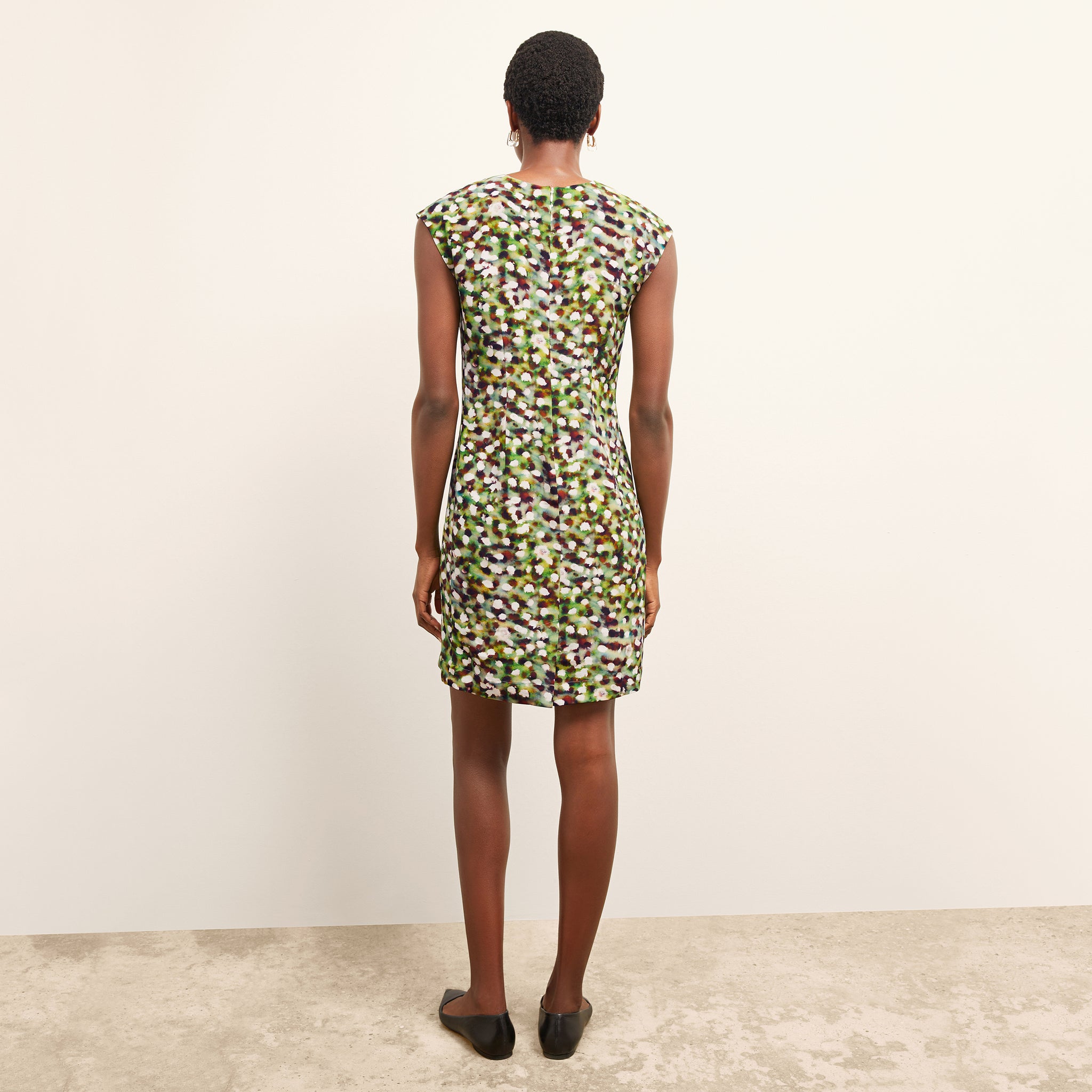 back image of a woman wearing the maaza dress in spotlight print