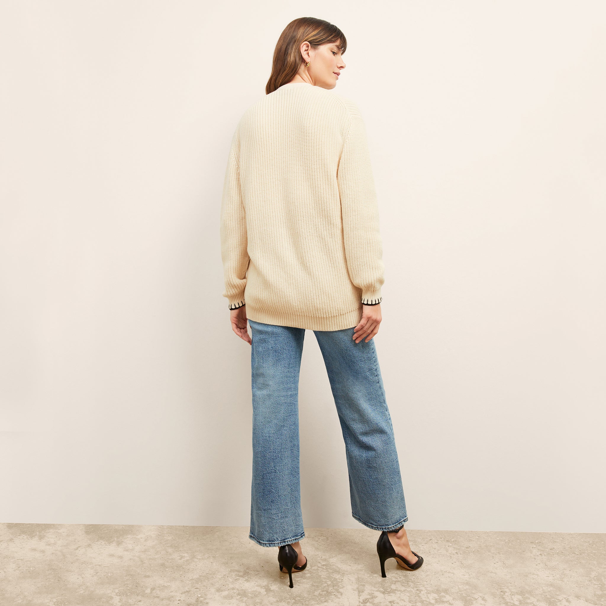 back image of a woman wearing the cookie cardigan in contrast knit