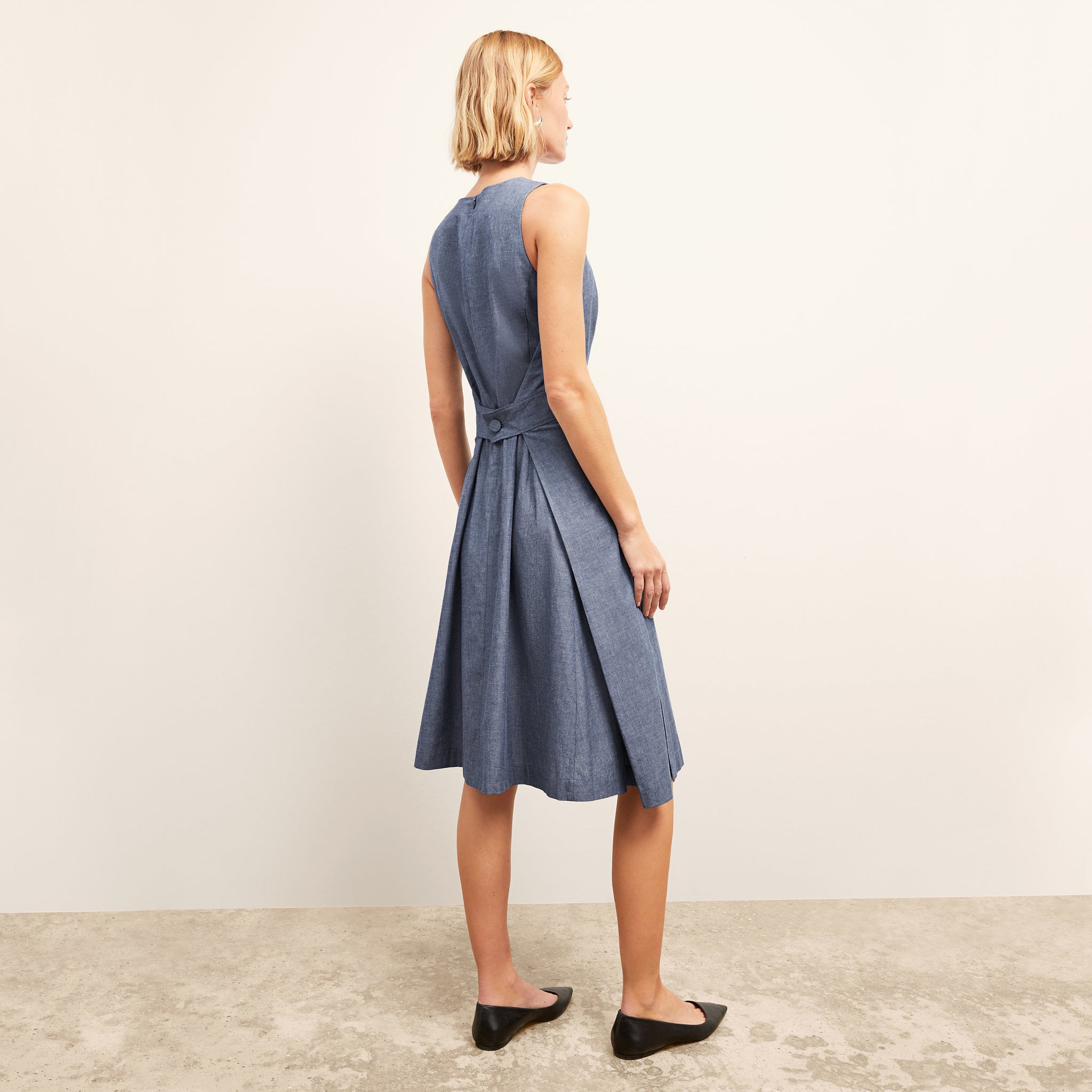 side image of the estela dress in clear blue