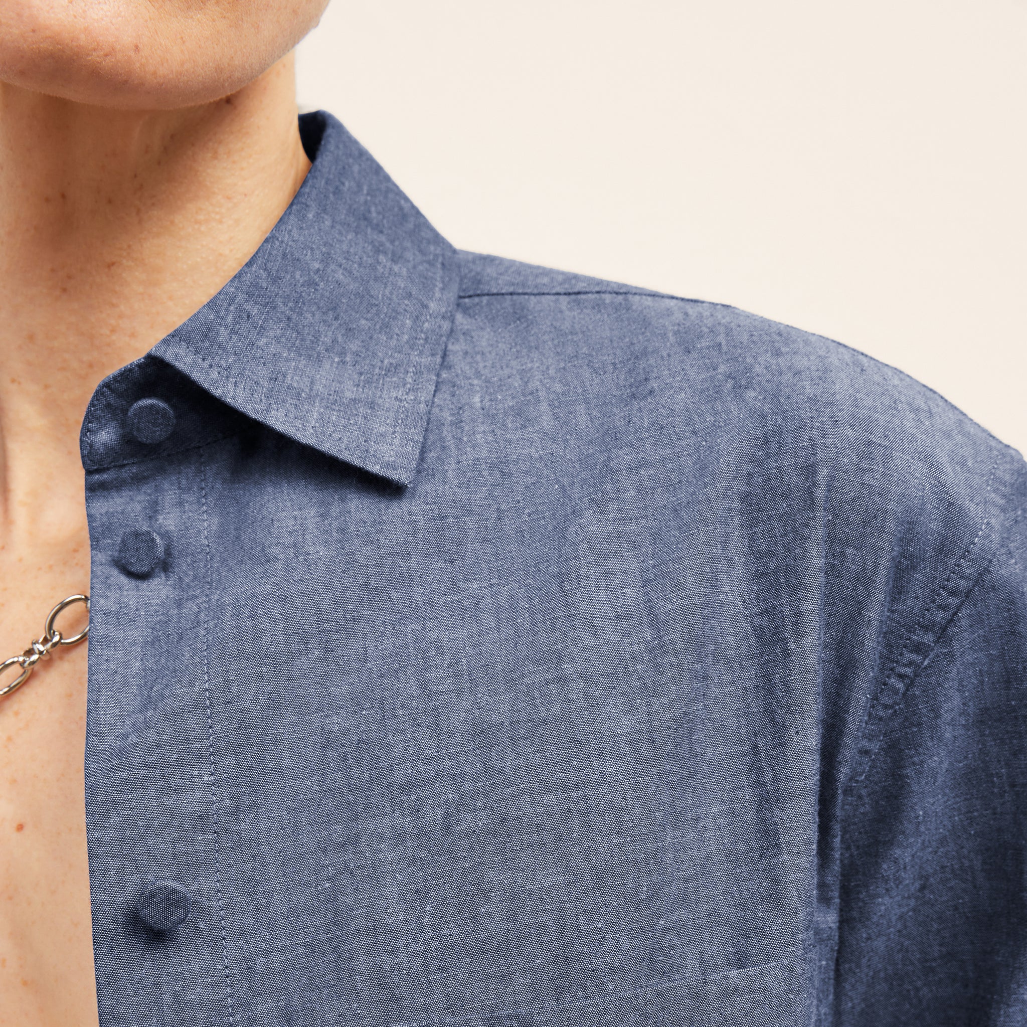 detail image of a woman wearing the siobhan top in clear blue