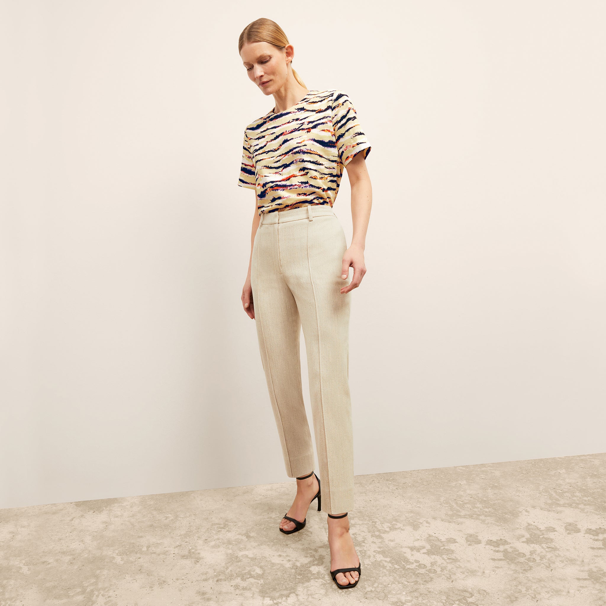 front image of a woman wearing the annika top in savannah print