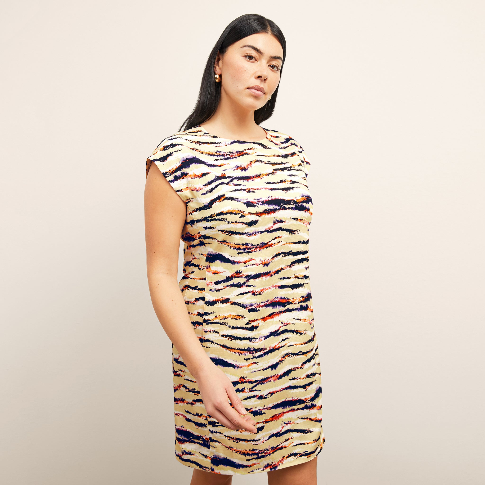 front image of a woman wearing the maaza dress in savannah print