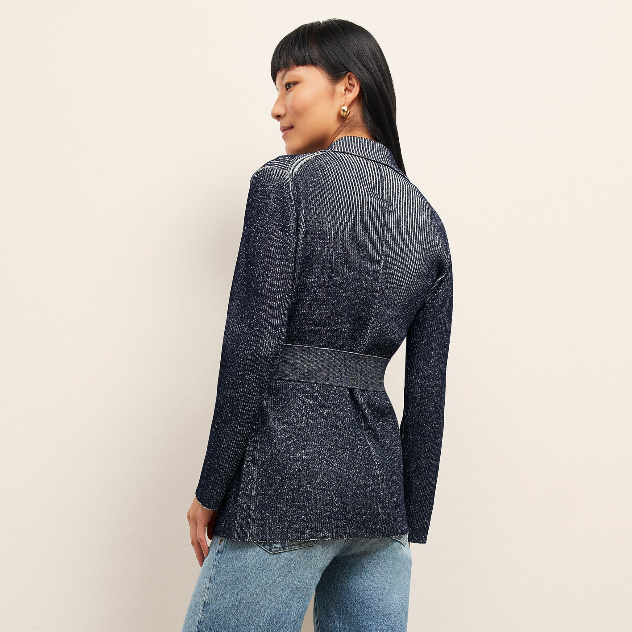 back image of a woman wearing the merritt jardigan in navy/ivory