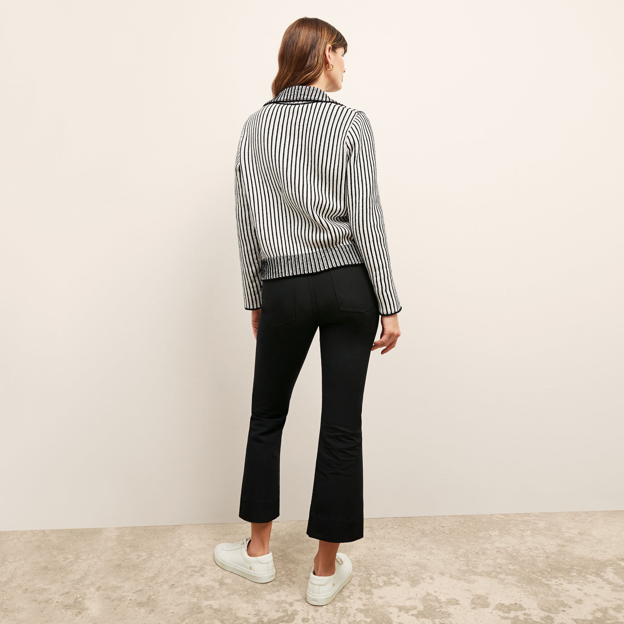back image of a woman wearing the maja sweater in black/ivory