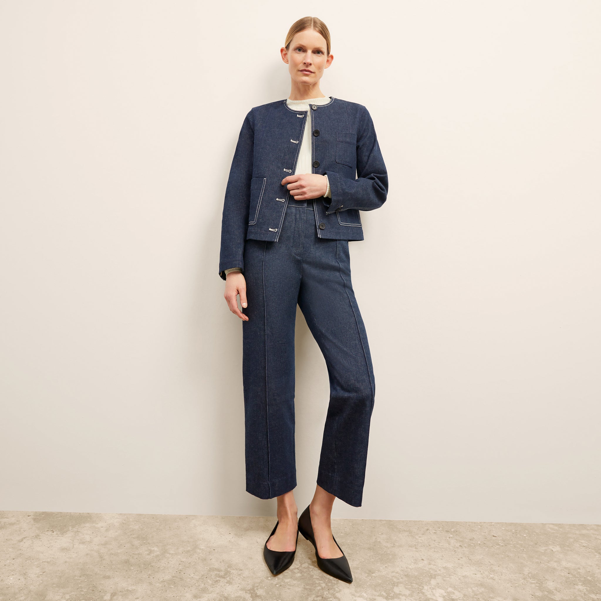 front image of a woman wearing the christy pant in dark wash