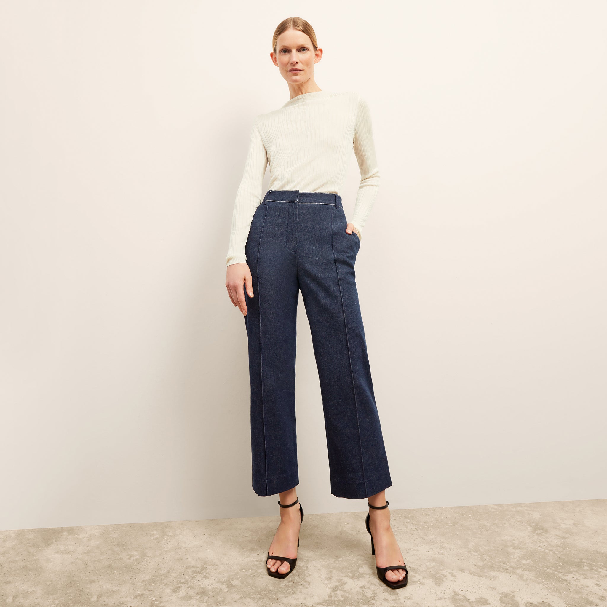 front image of a woman wearing the christy pant in dark wash 