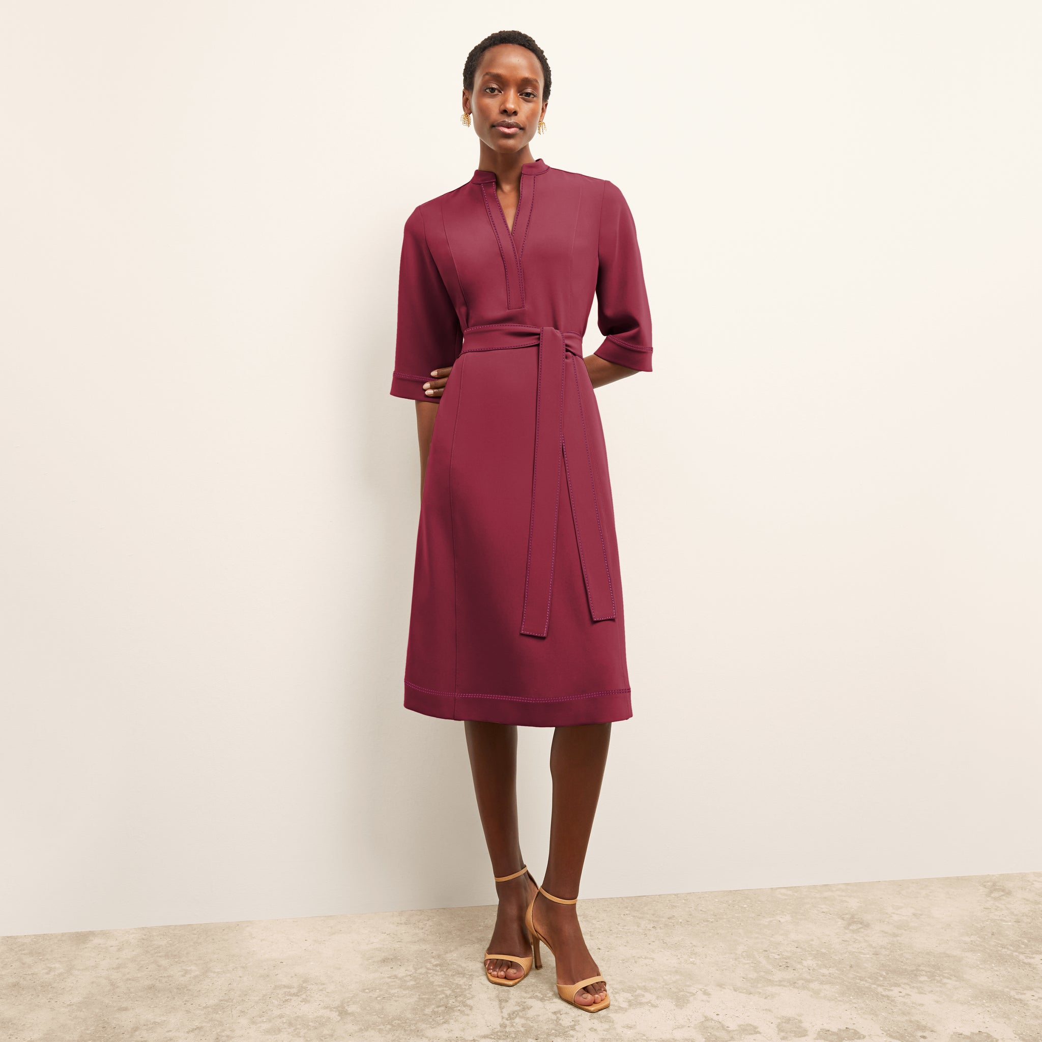 image of a woman wearing the lauleh dress in dark fuchsia 