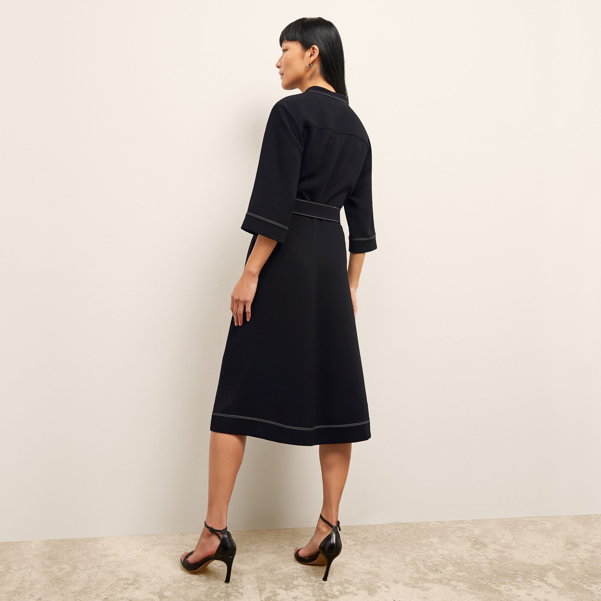 back image of a woman wearing the lauleh dress in black