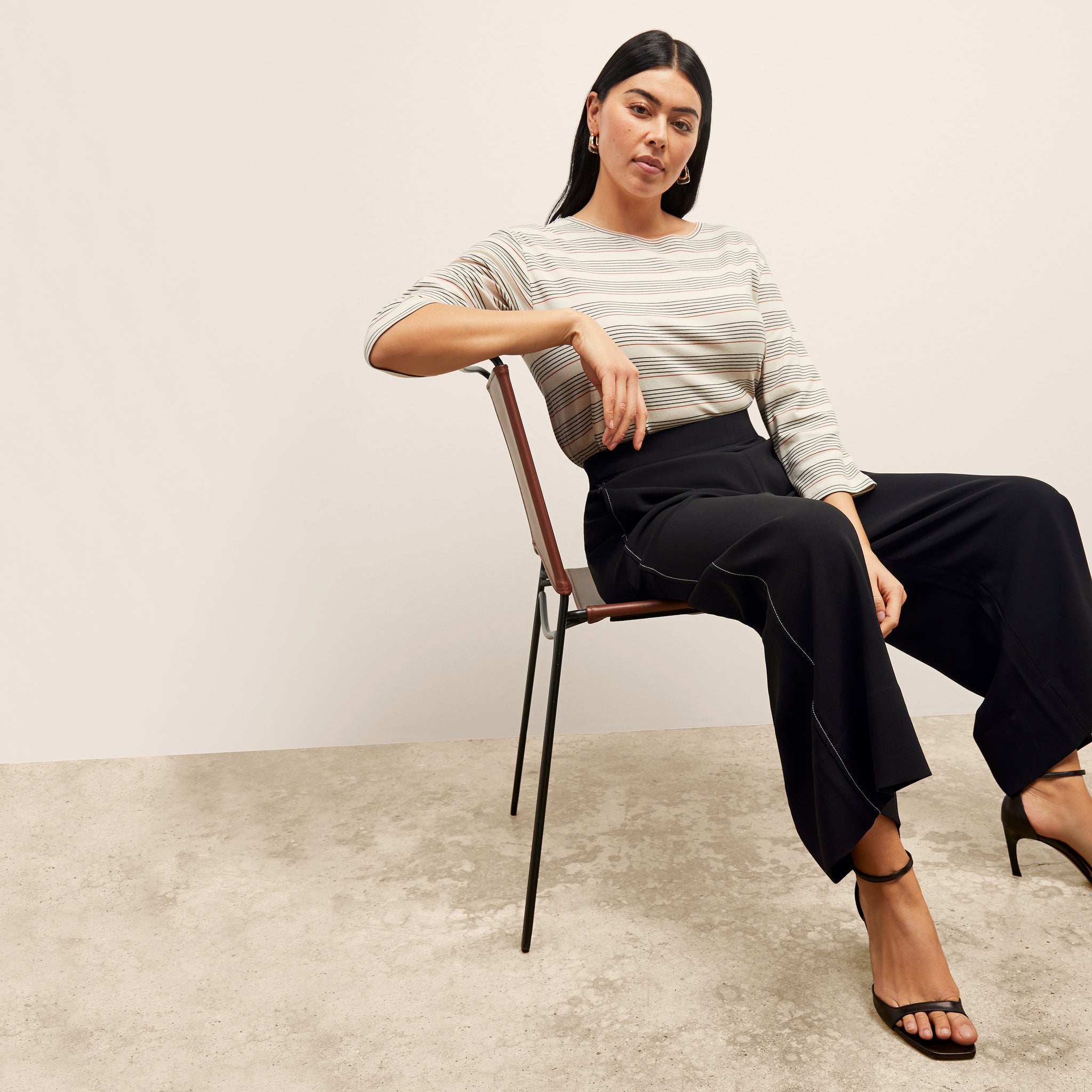 front image of a woman wearing the elena pant in black