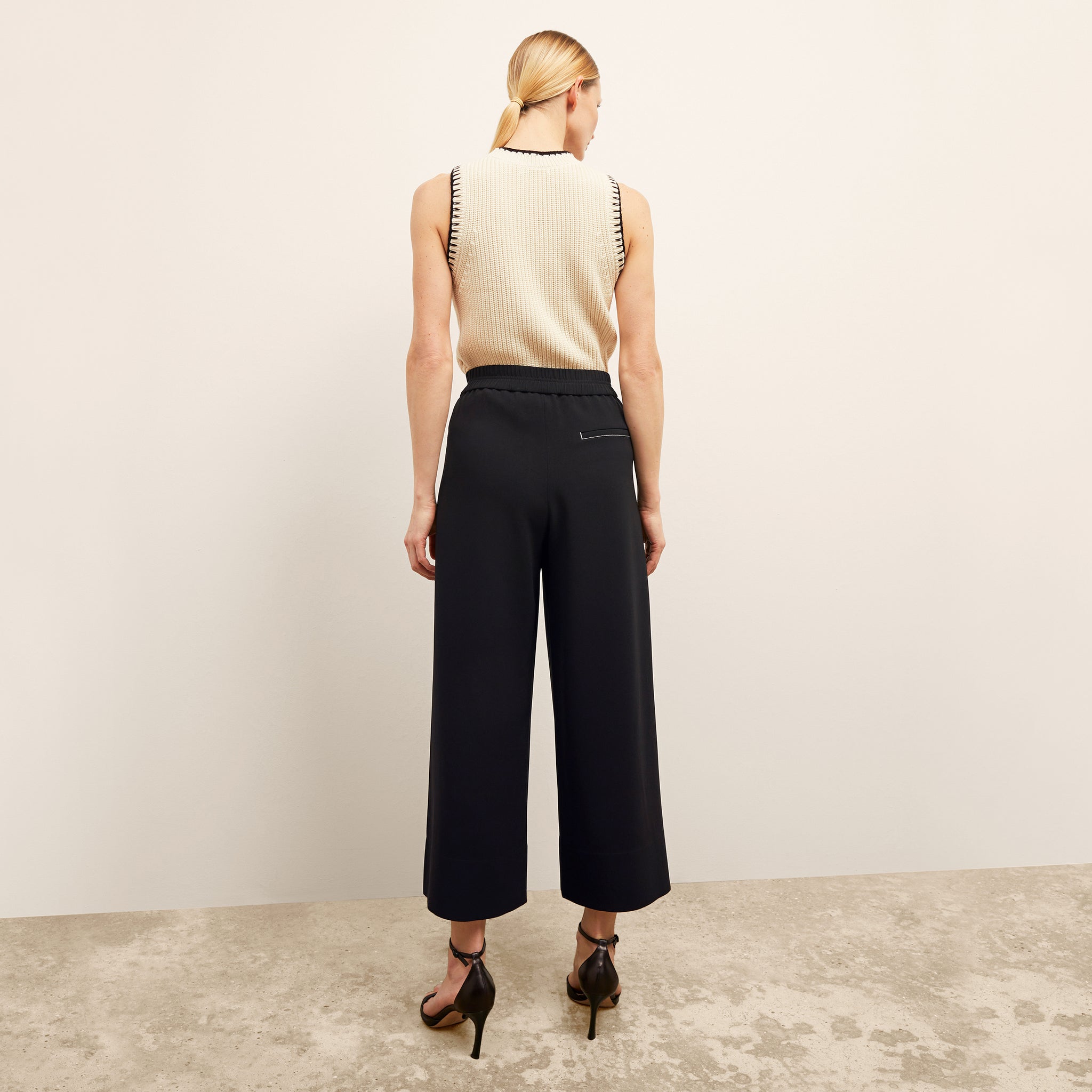 back image of a woman wearing the elena pant in black