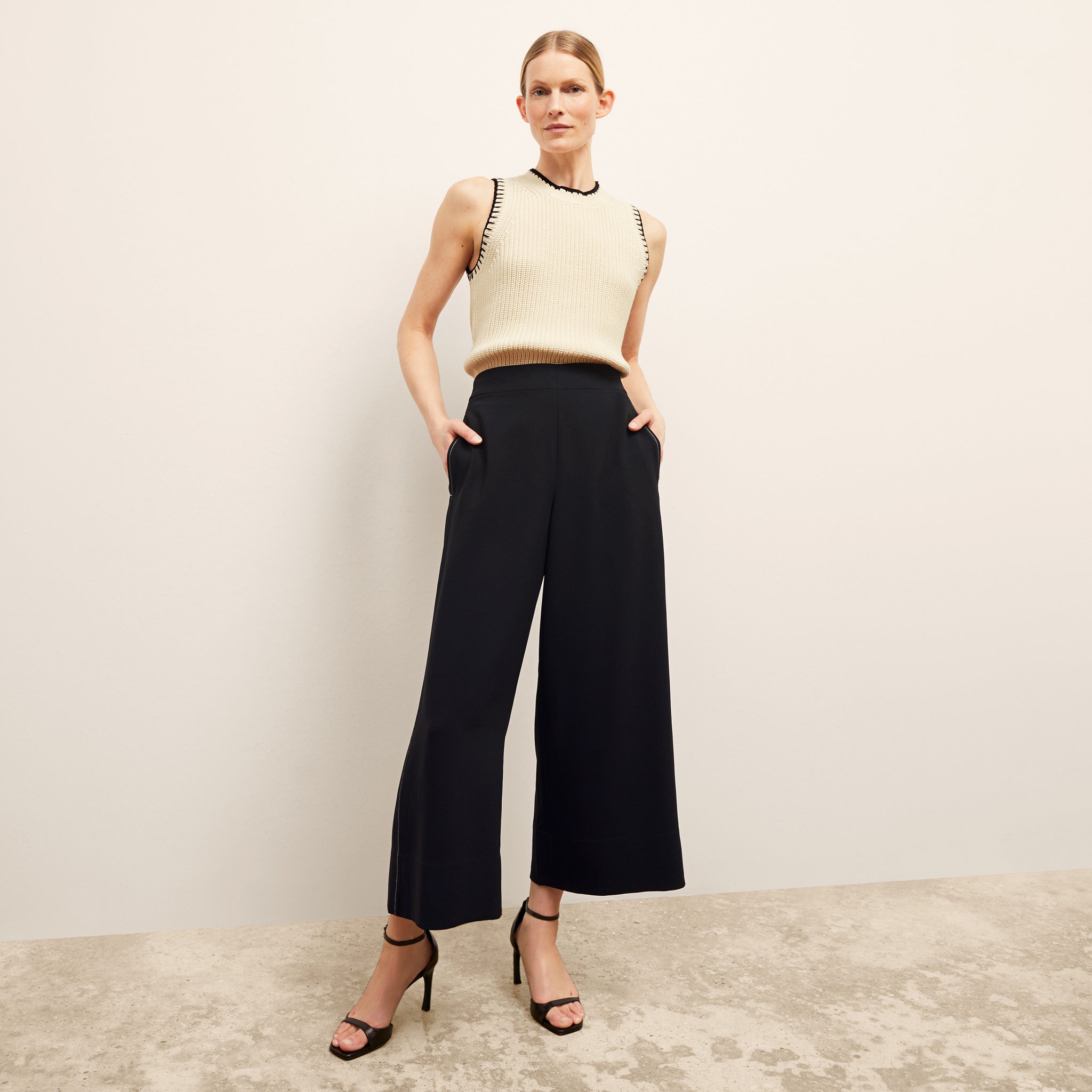 front image of a woman wearing the elena pant in black 