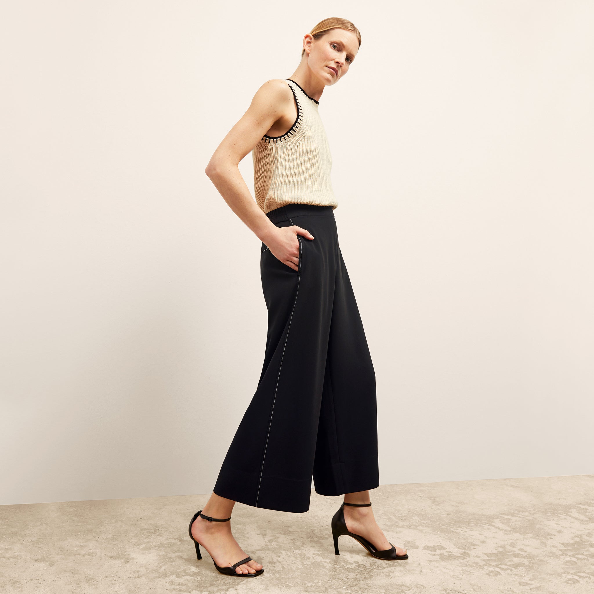 side image of a woman wearing the elena pant in black