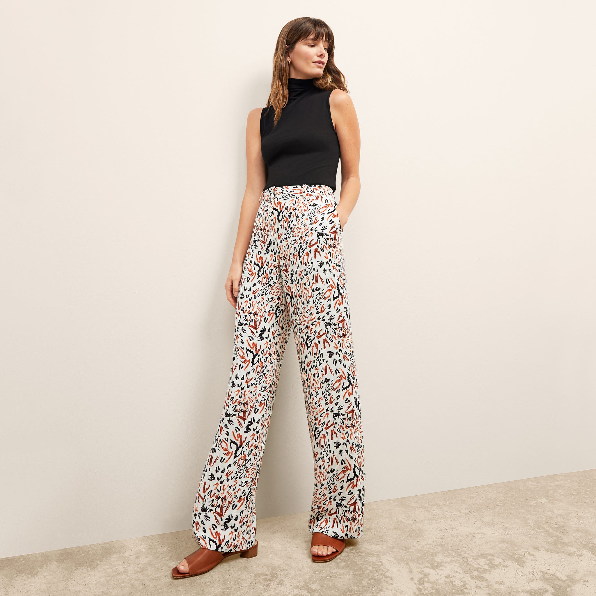 front image of a woman wearing the tinsley trousers in leopard sketch 