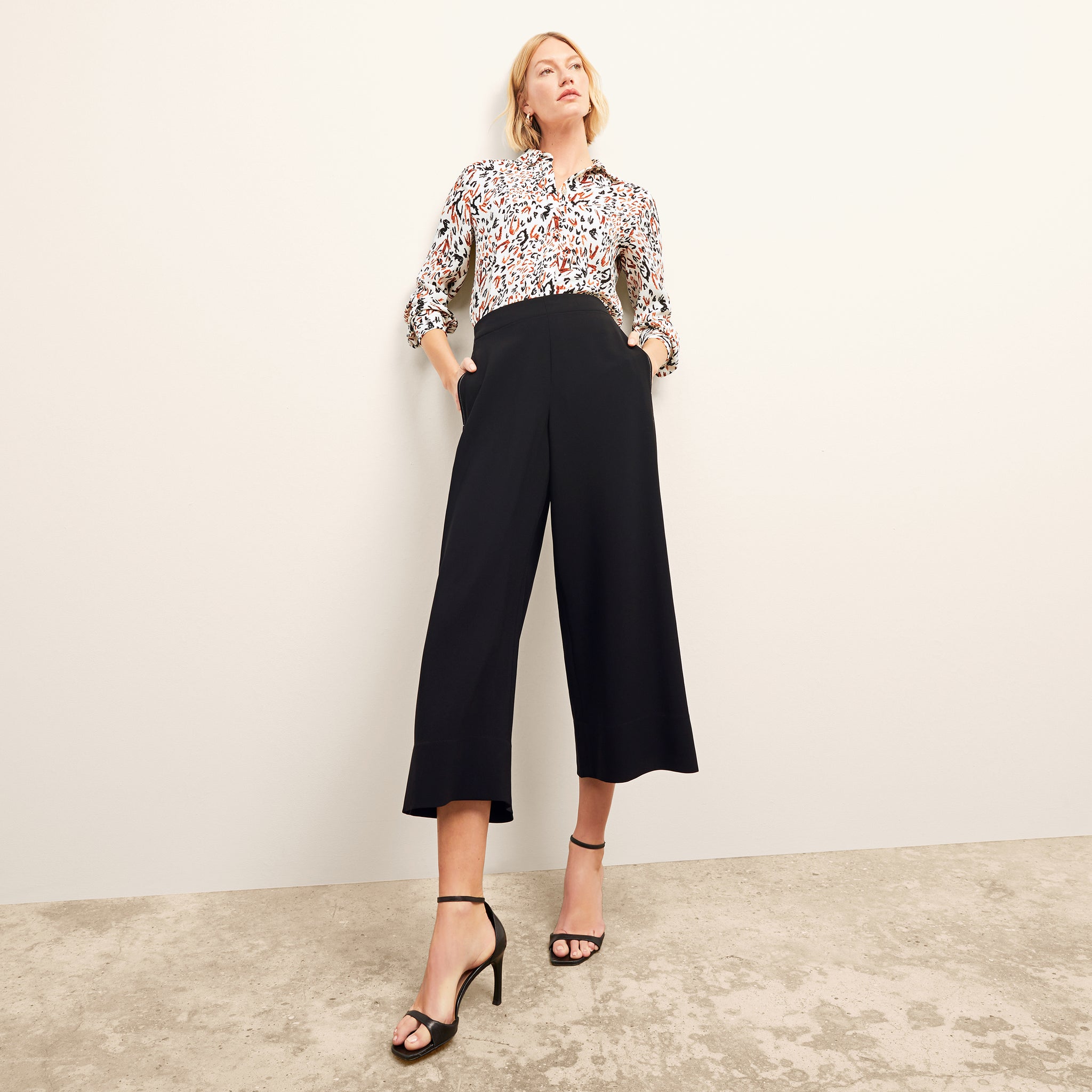 front image of a woman wearing the elena pant in black