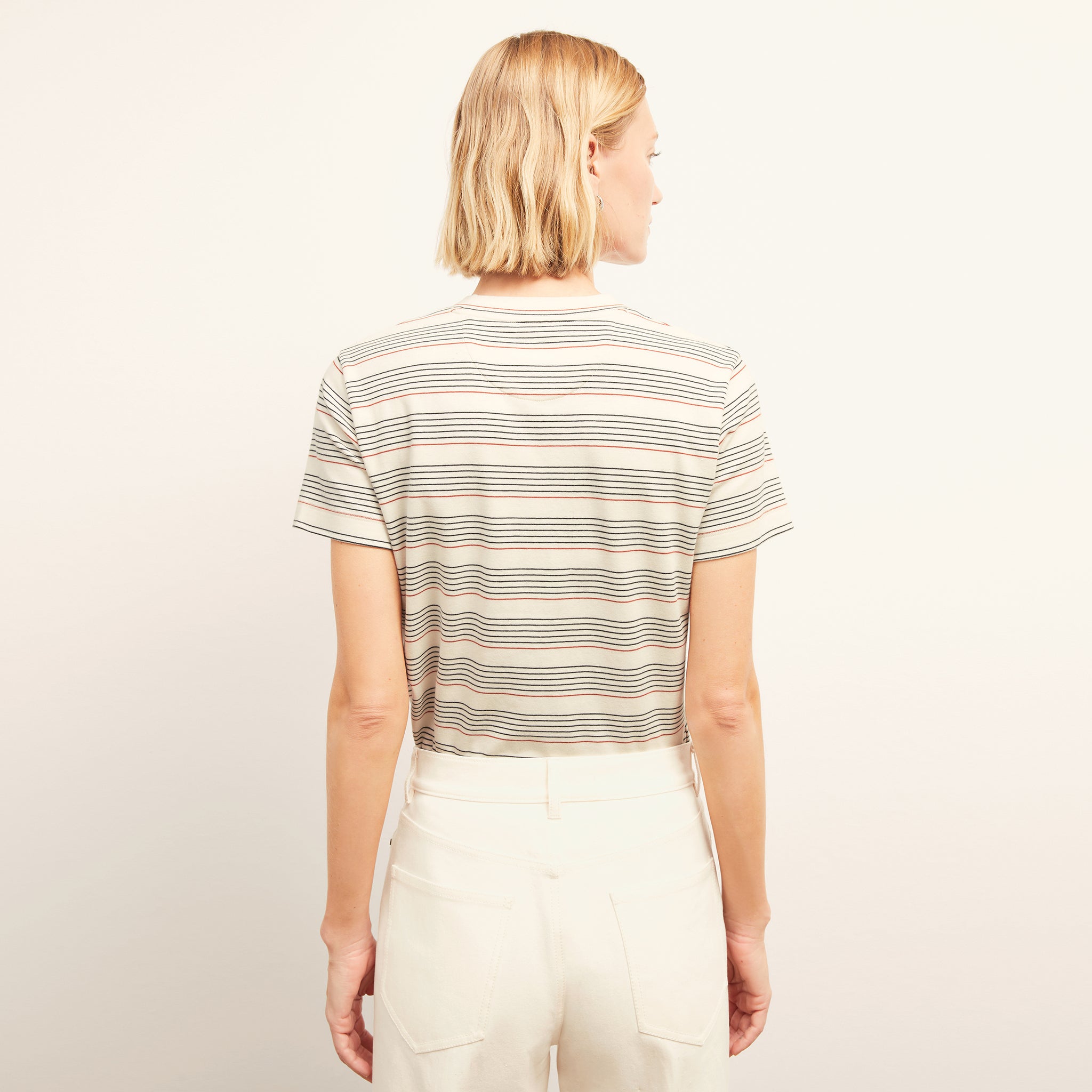 back image of a woman wearing the leslie t-shirt in signature stripe