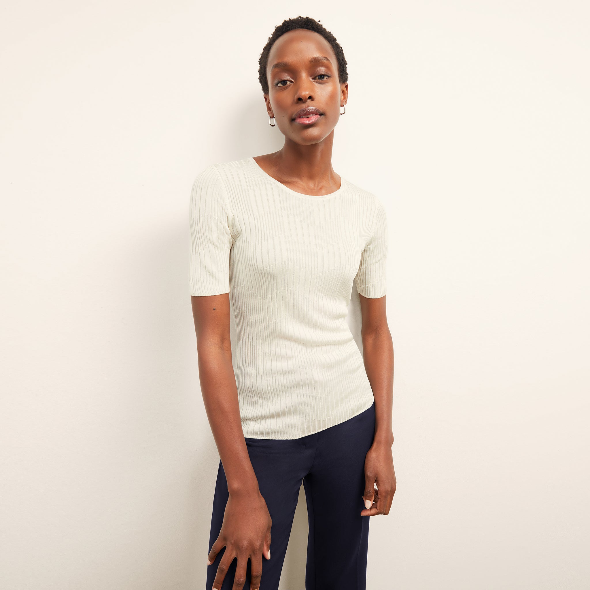 front image of a woman wearing the charlie top in ivory 