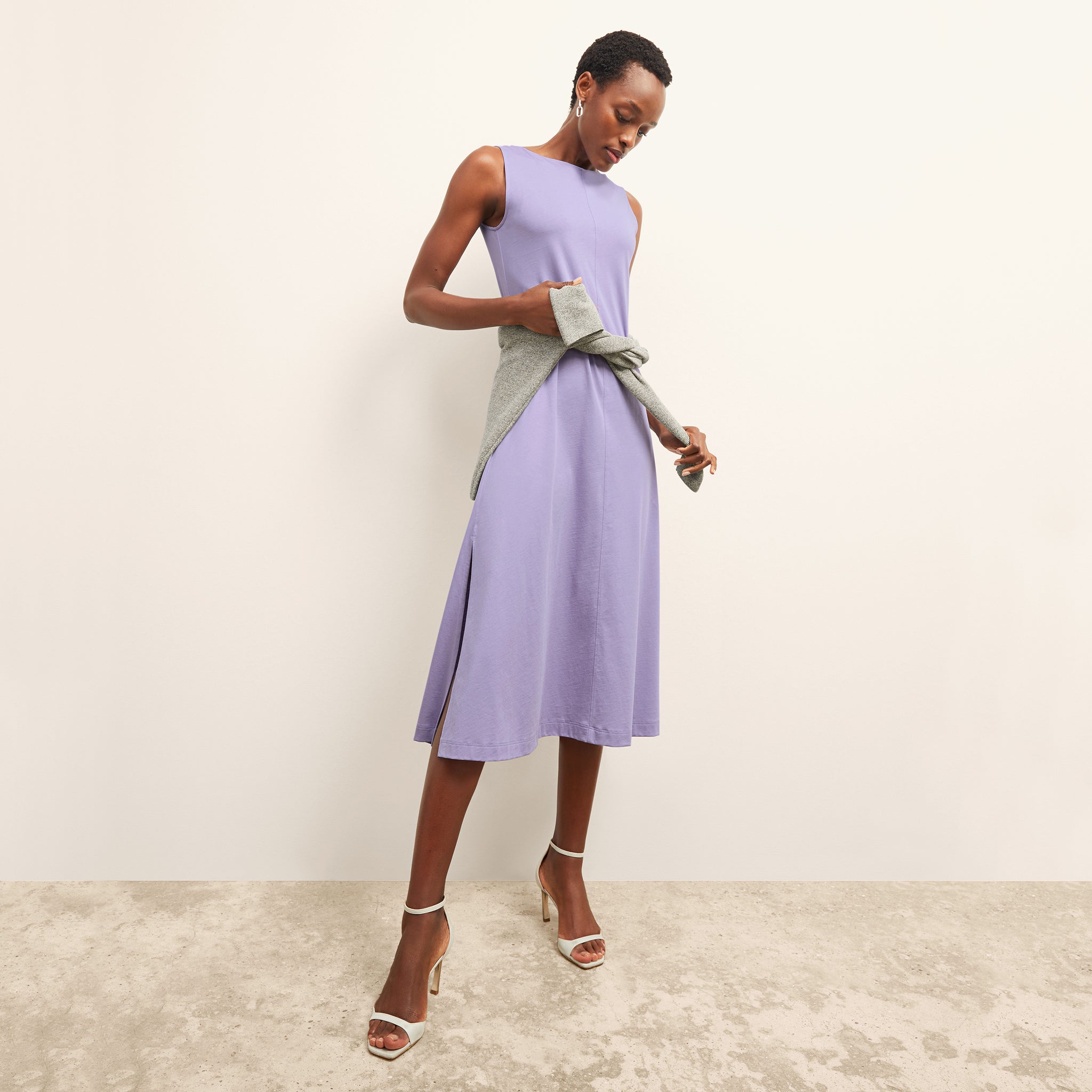 front image of a woman wearing the milano dress in light orchid