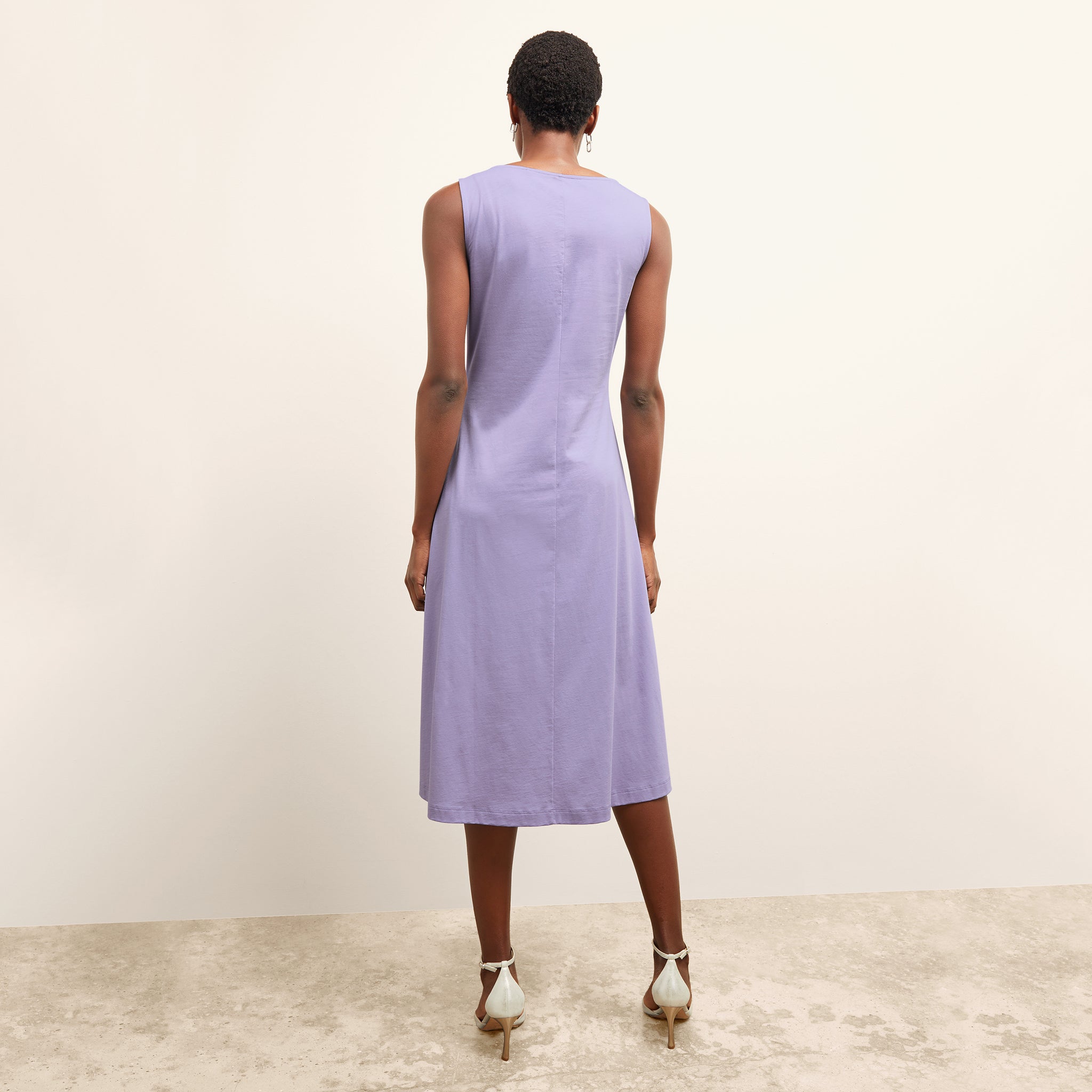 back image of a woman wearing the milano dress in light orchid