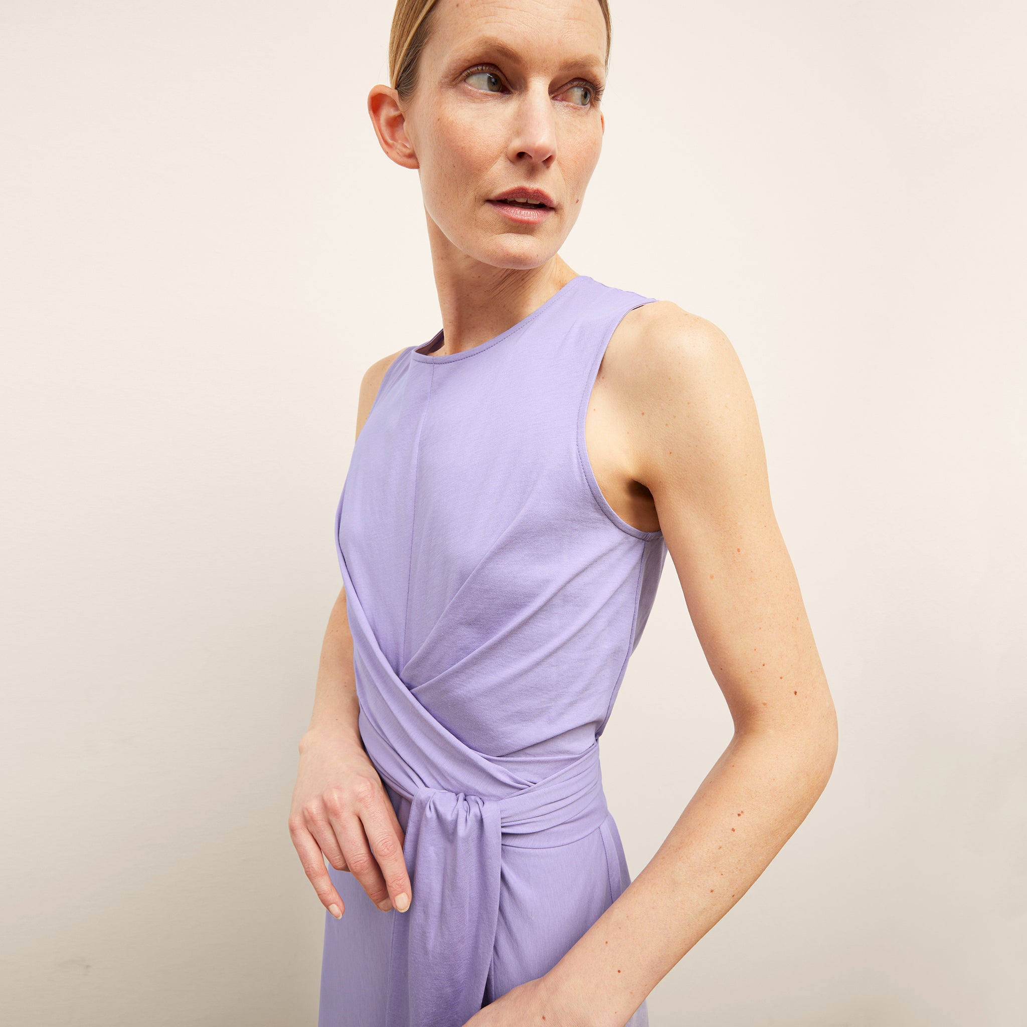 front image of a woman wearing the monte dress in light orchid