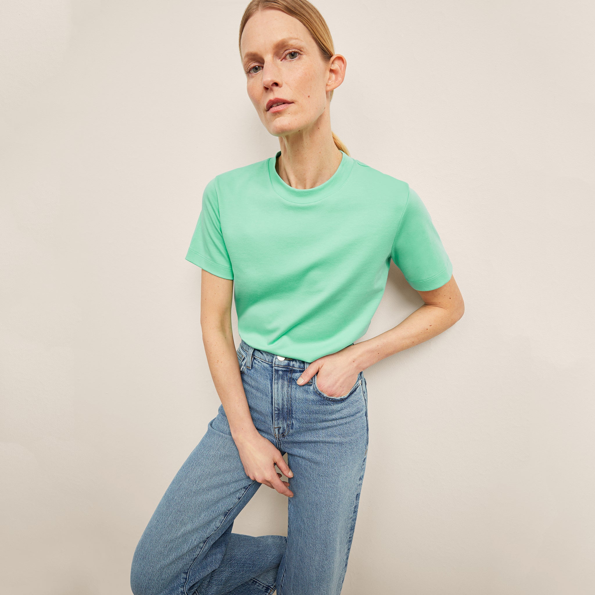 front image of a woman weairng the New York Liberty Leslie T-Shirt in Seafoam 