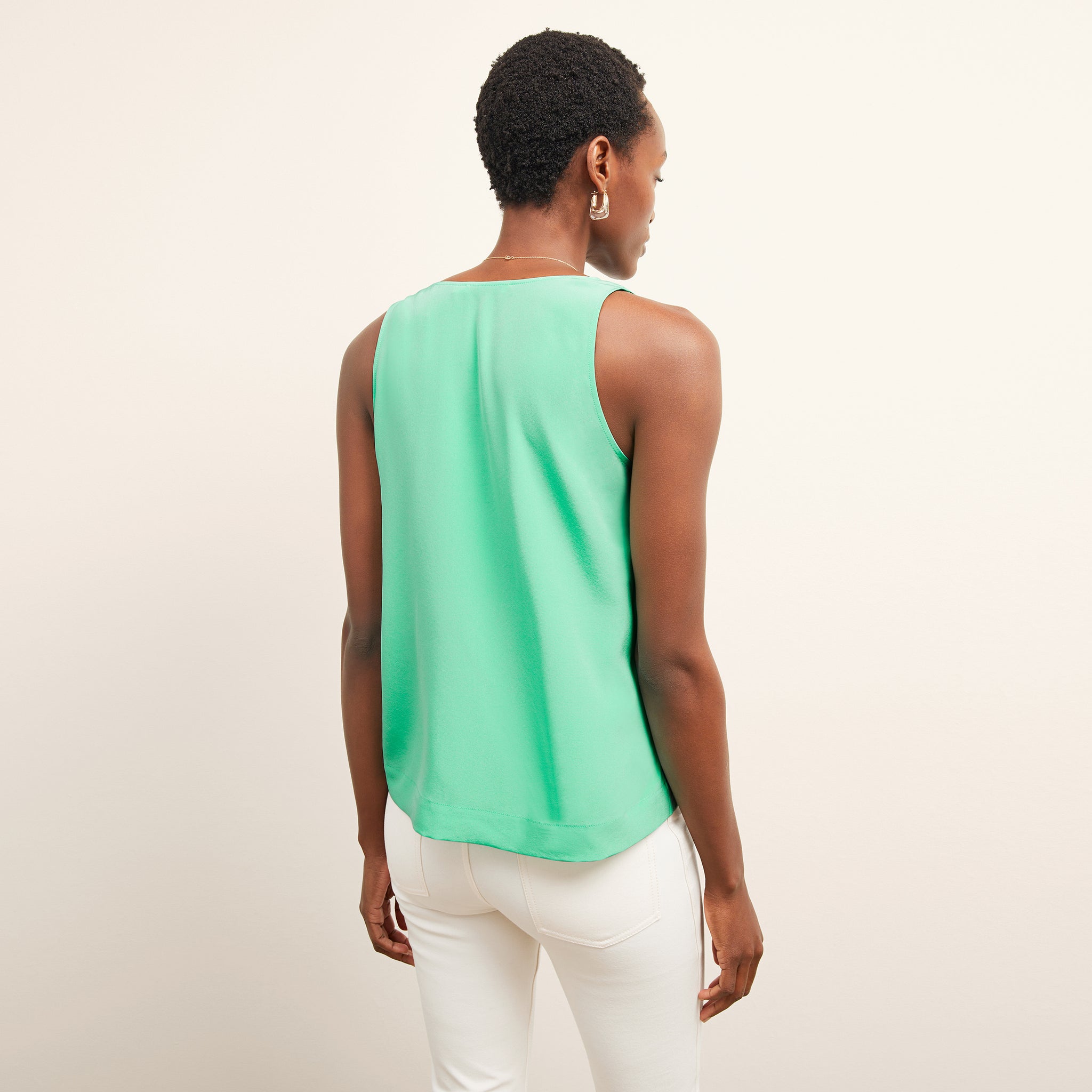 back image of a woman wearing the vicky tank in seafoam