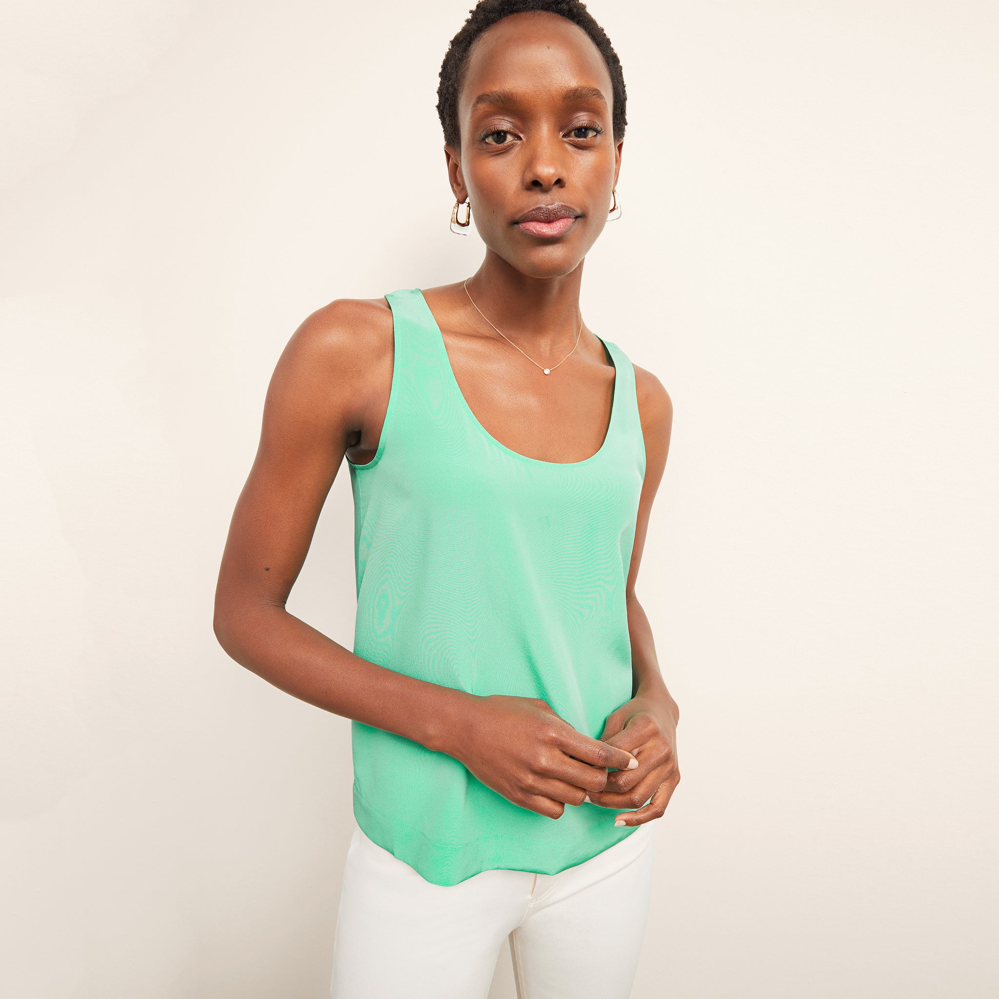 front image of a woman wearing the vicky tank in seafoam 