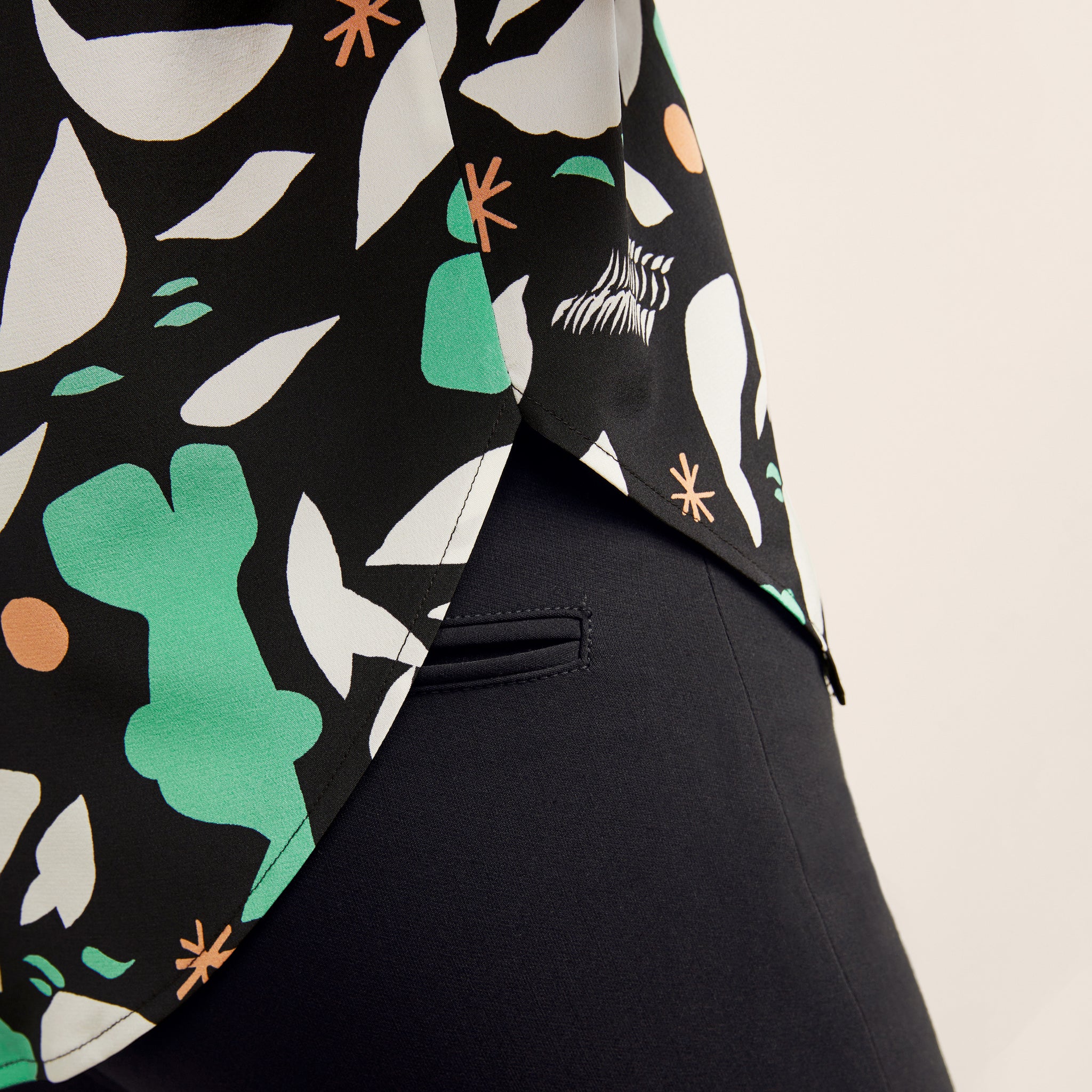 detail image of a woman wearing the didion top in seafoam icon print