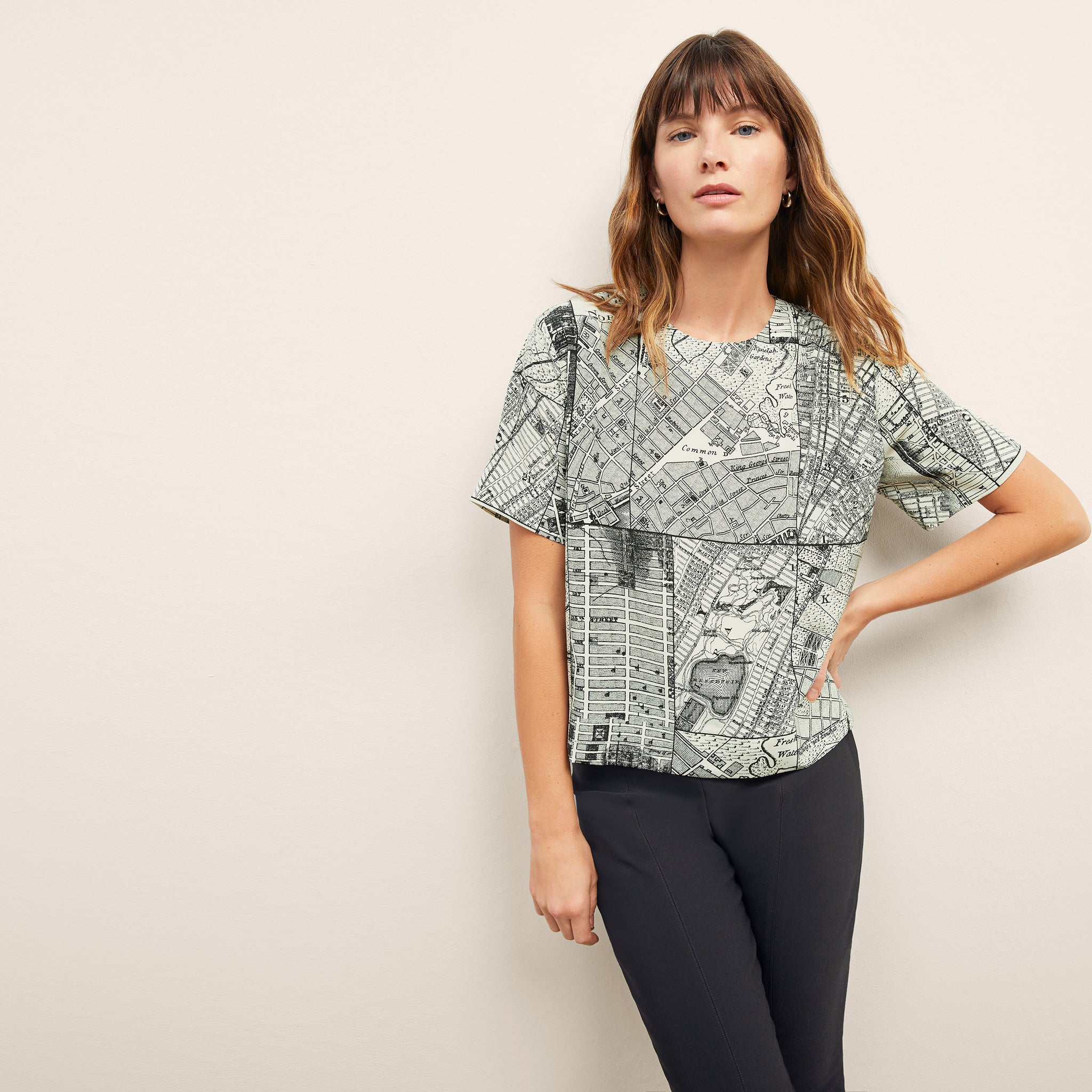 front image of a woman wearing the annika top in borough print 