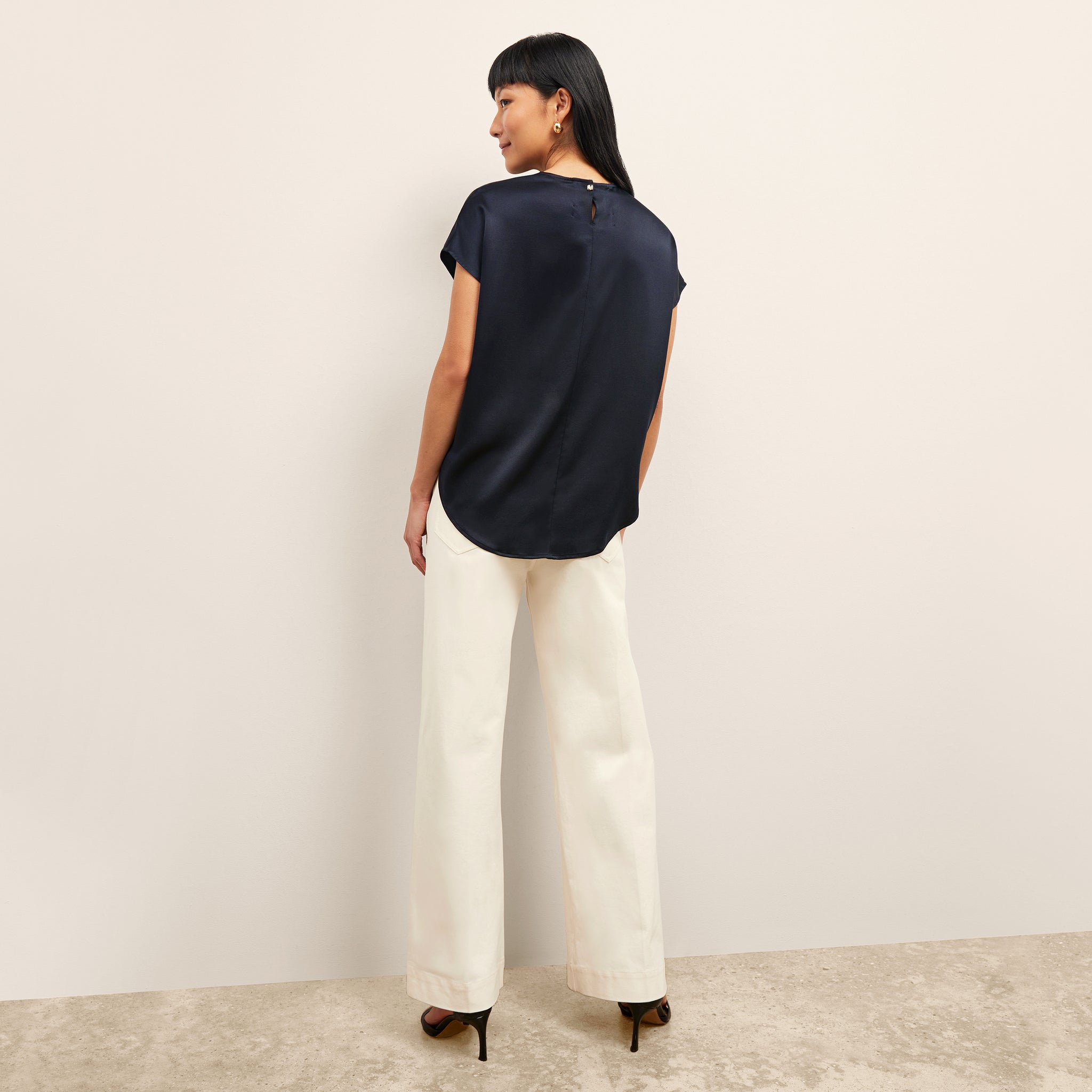 Back image of a woman wearing the Didion Top in Galaxy Blue