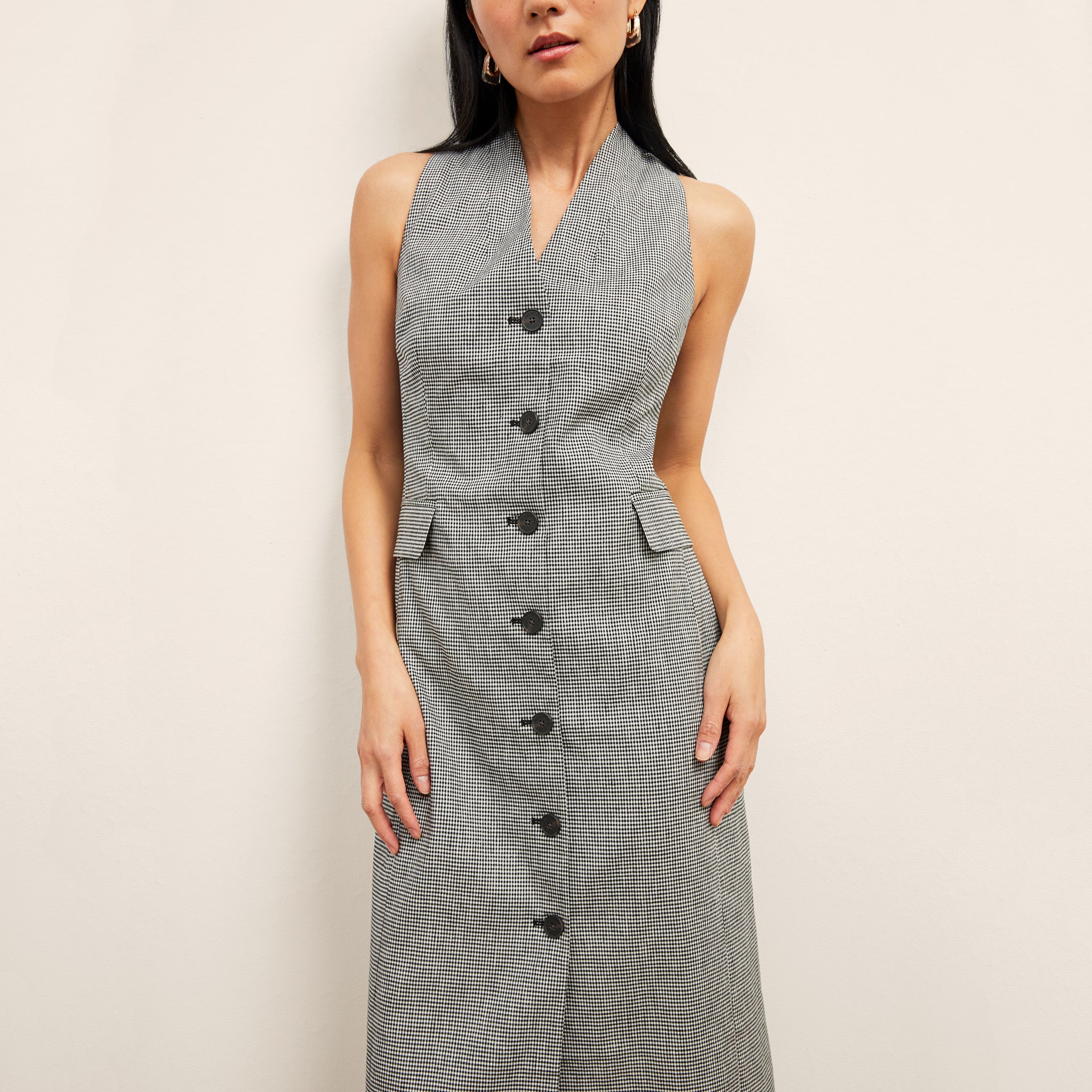 front image of a woman wearing the cassandra dress in gingham linen