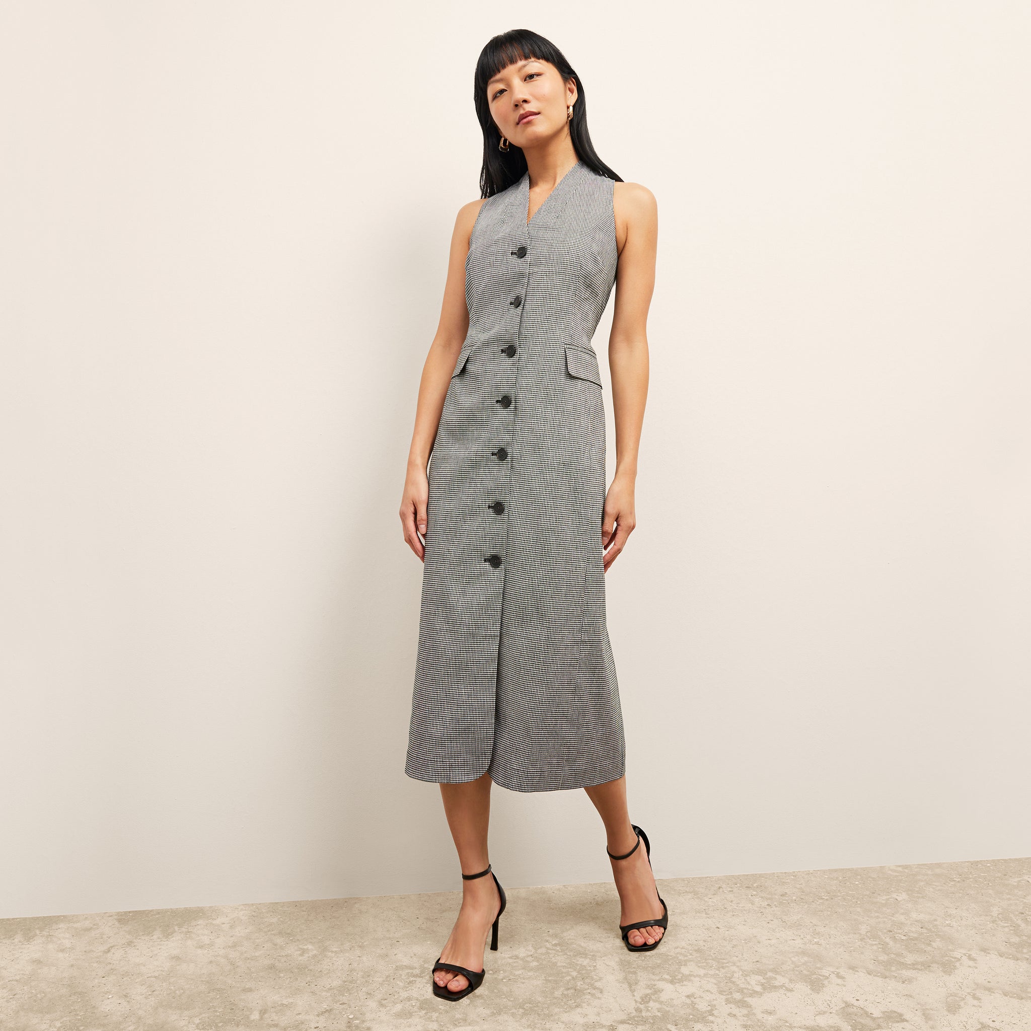 front image of a woman wearing the cassandra dress in gingham linen 