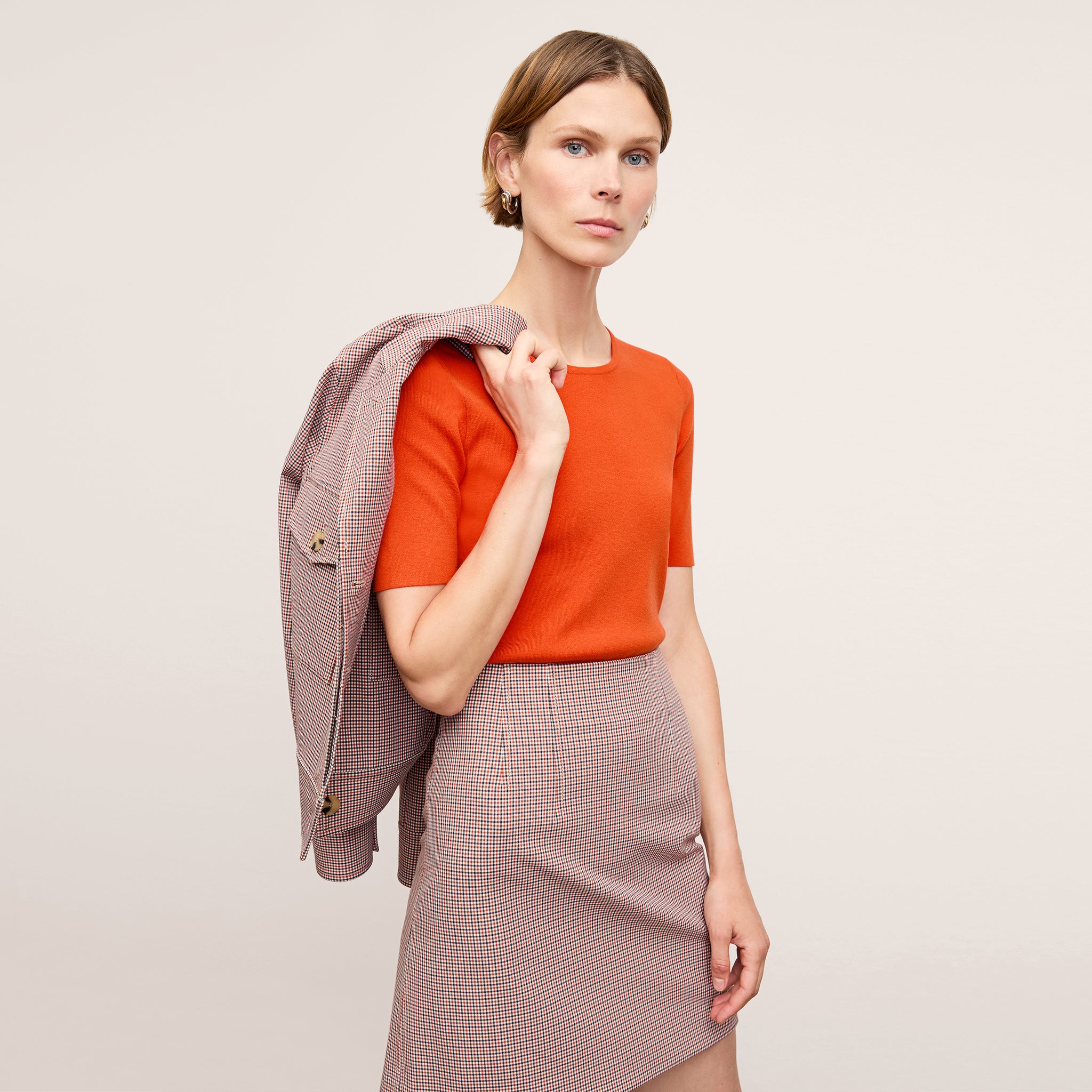 Front image of a woman wearing the Choe Top in Apricot 