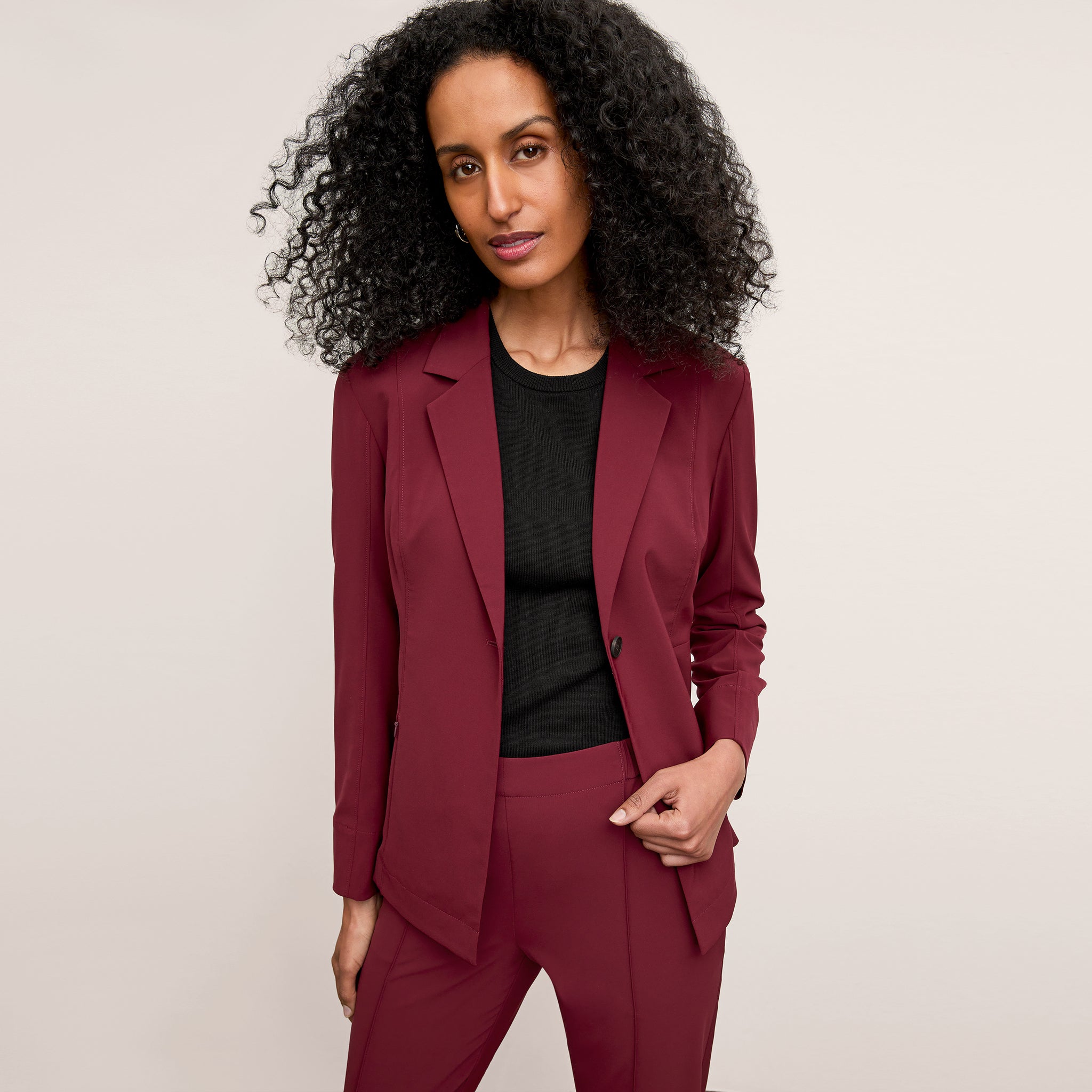 front image of a woman wearing the moreland jacket in berry jam 