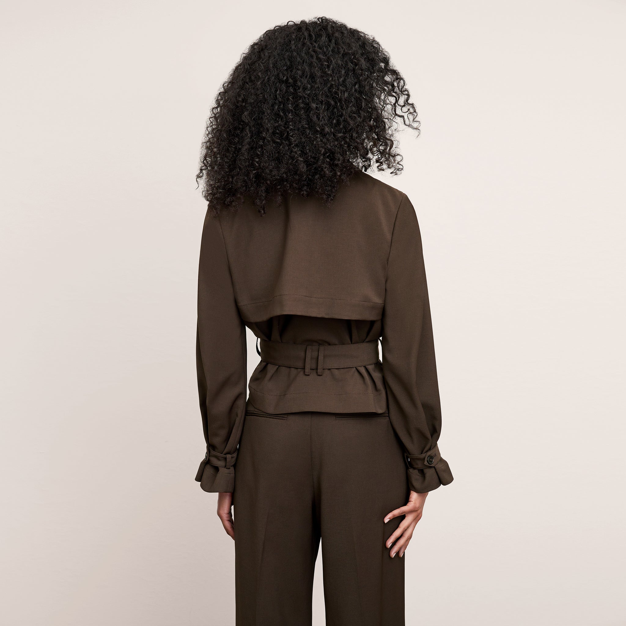 Back image of a woman wearing the Scotte Jacket in Date