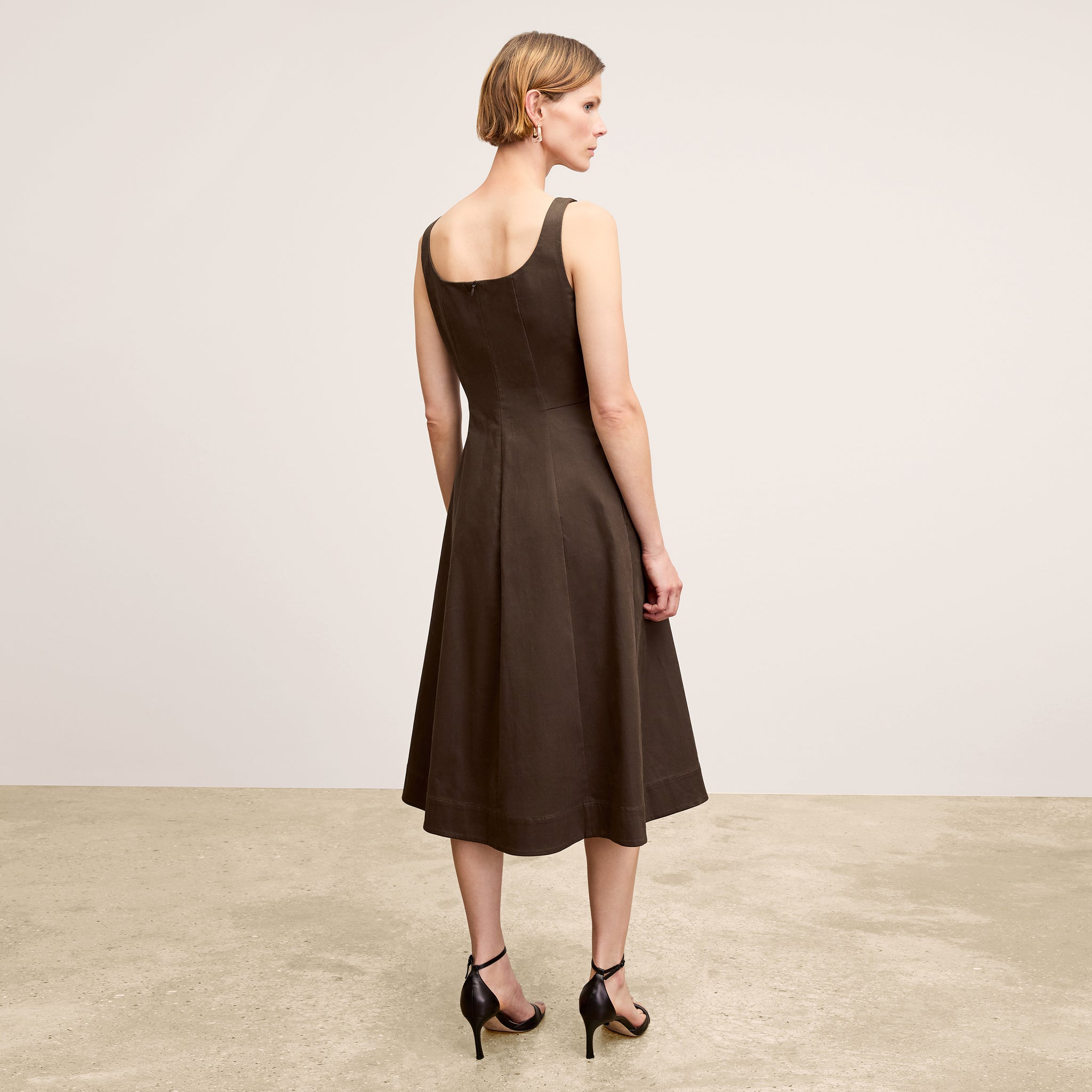 Back image of a woman wearing the Jess Dress in Date