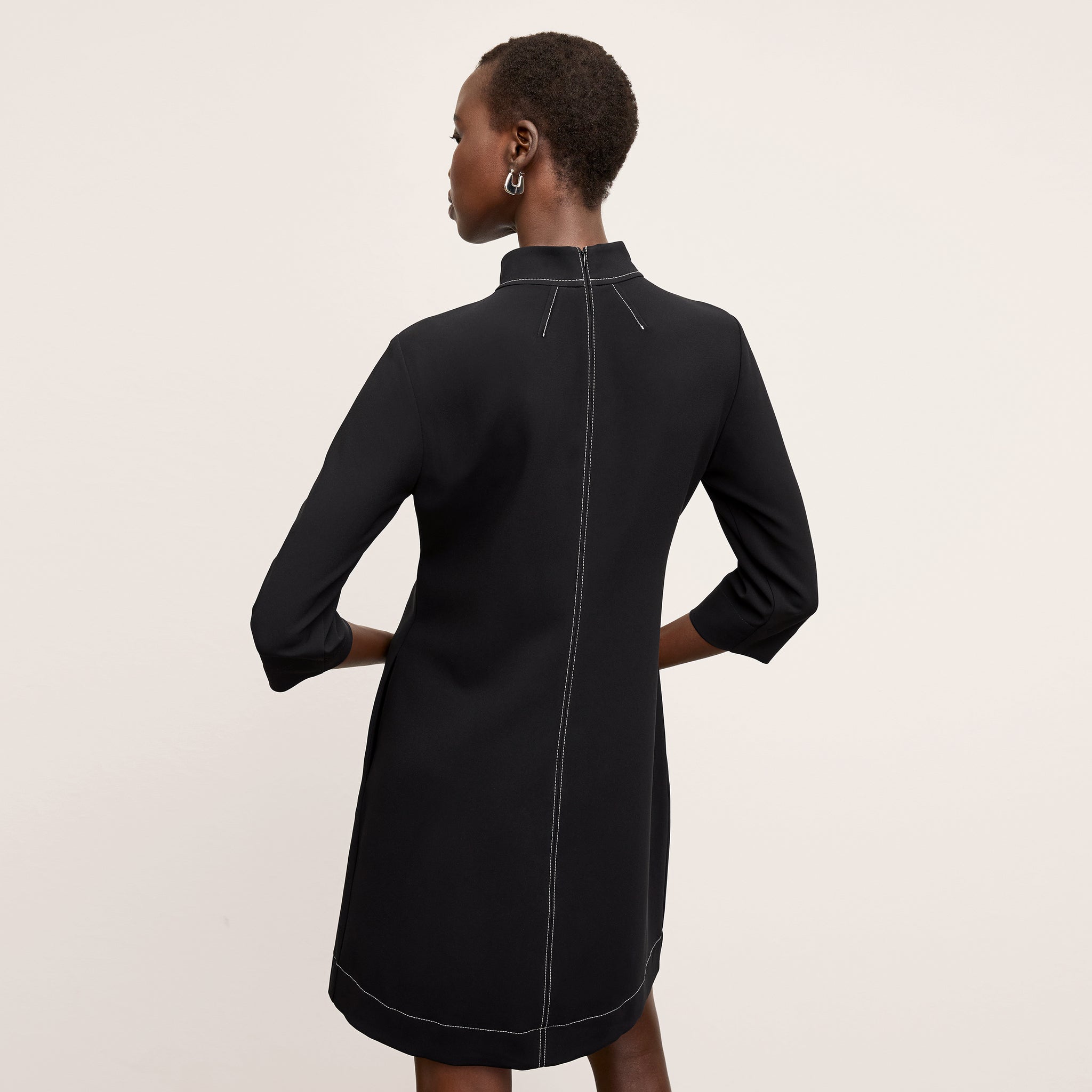 back image of a woman wearing the kinsley dress in black