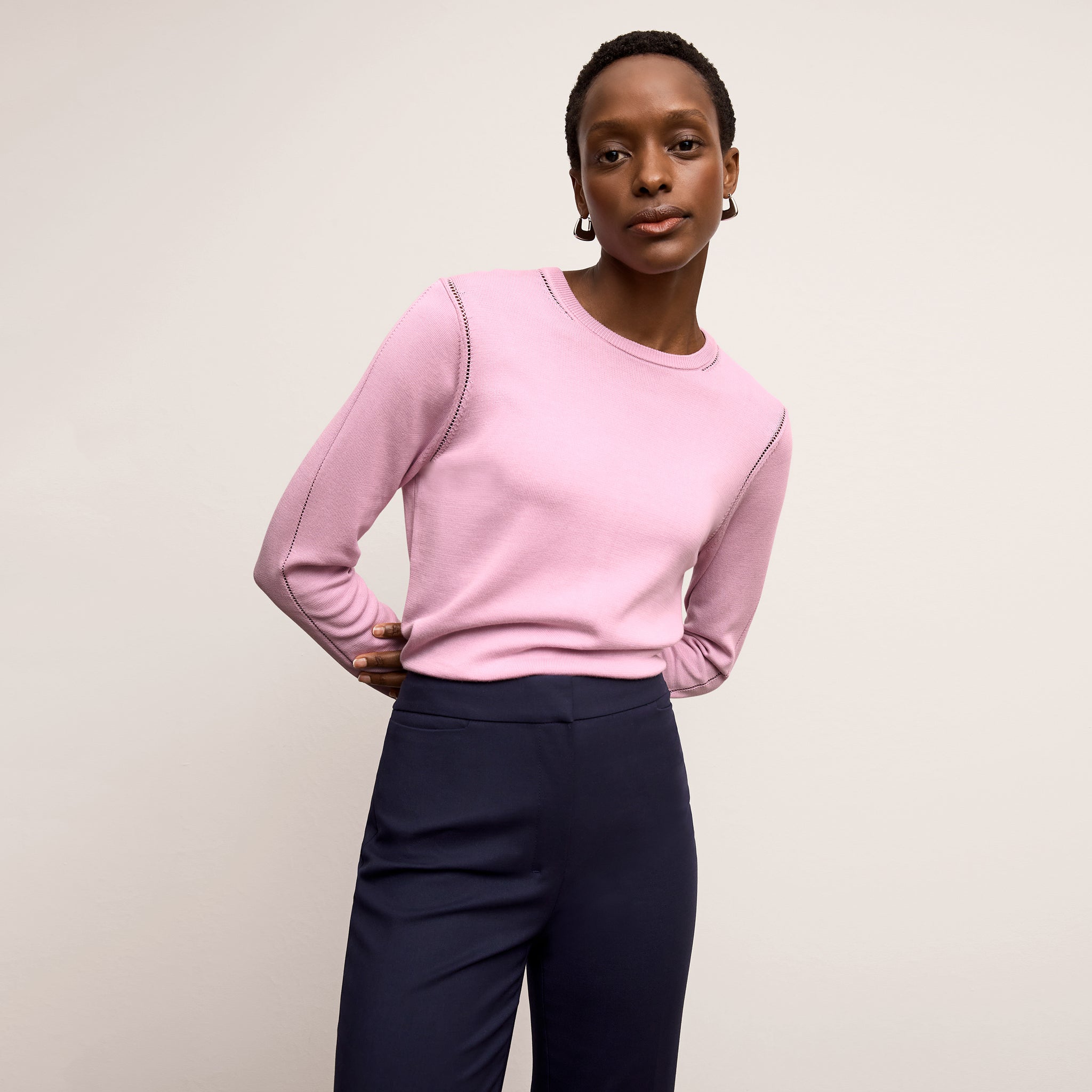 front image of a woman wearing the larissa sweater in taffy