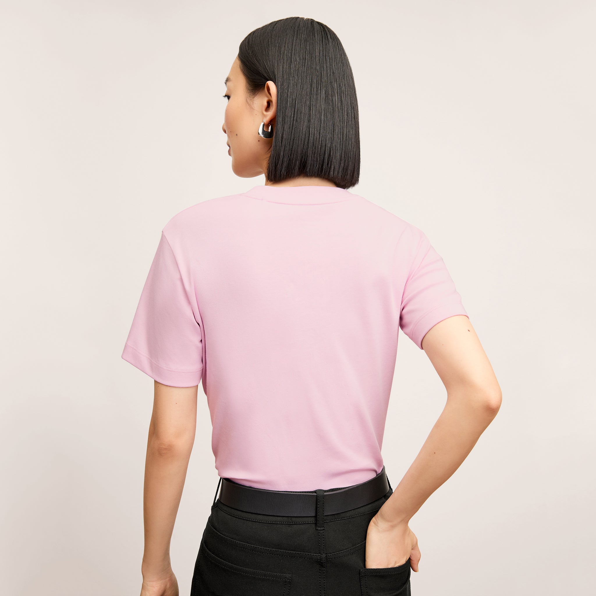 Back image of a woman wearing the Leslie Top in Hyacinth