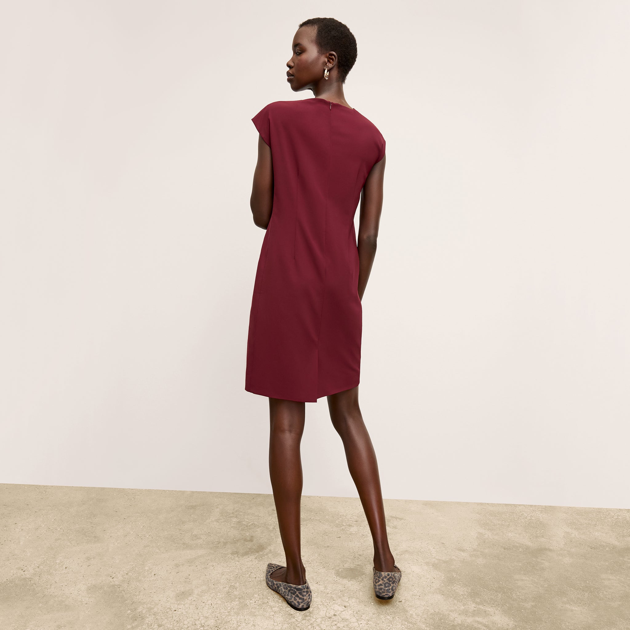 back image of a woman wearing the maaza dress in berry jam