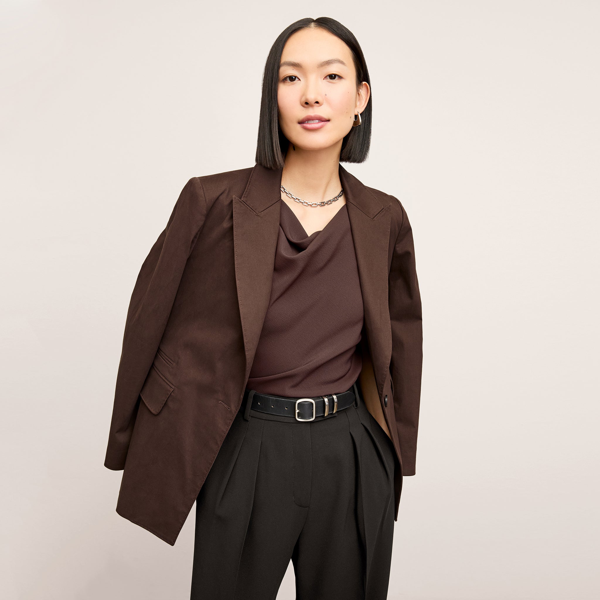 Front image of a woman wearing the Tyner jacket in stretch chino in date