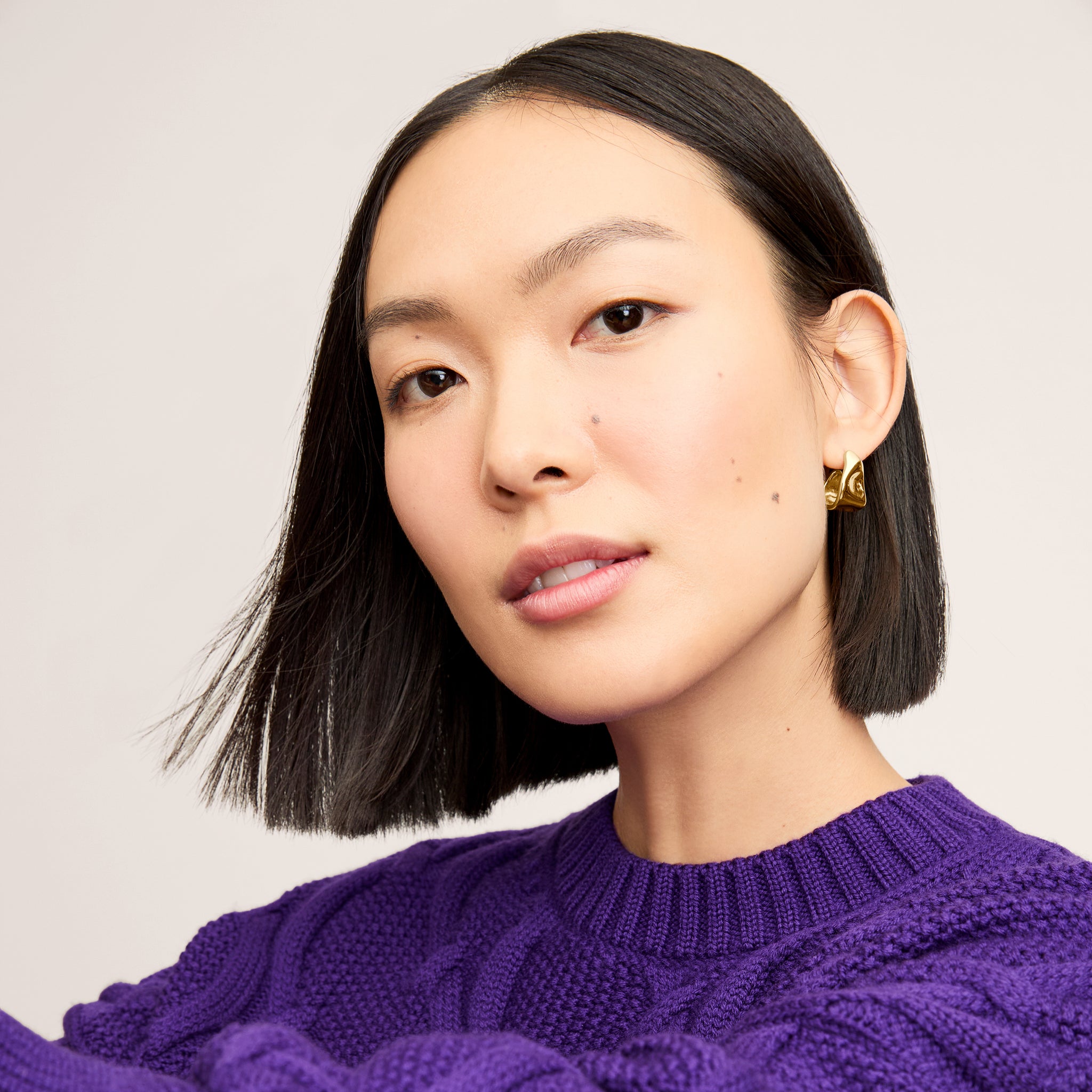 Detail image of a woman wearing the Kiki Sweater in Ube