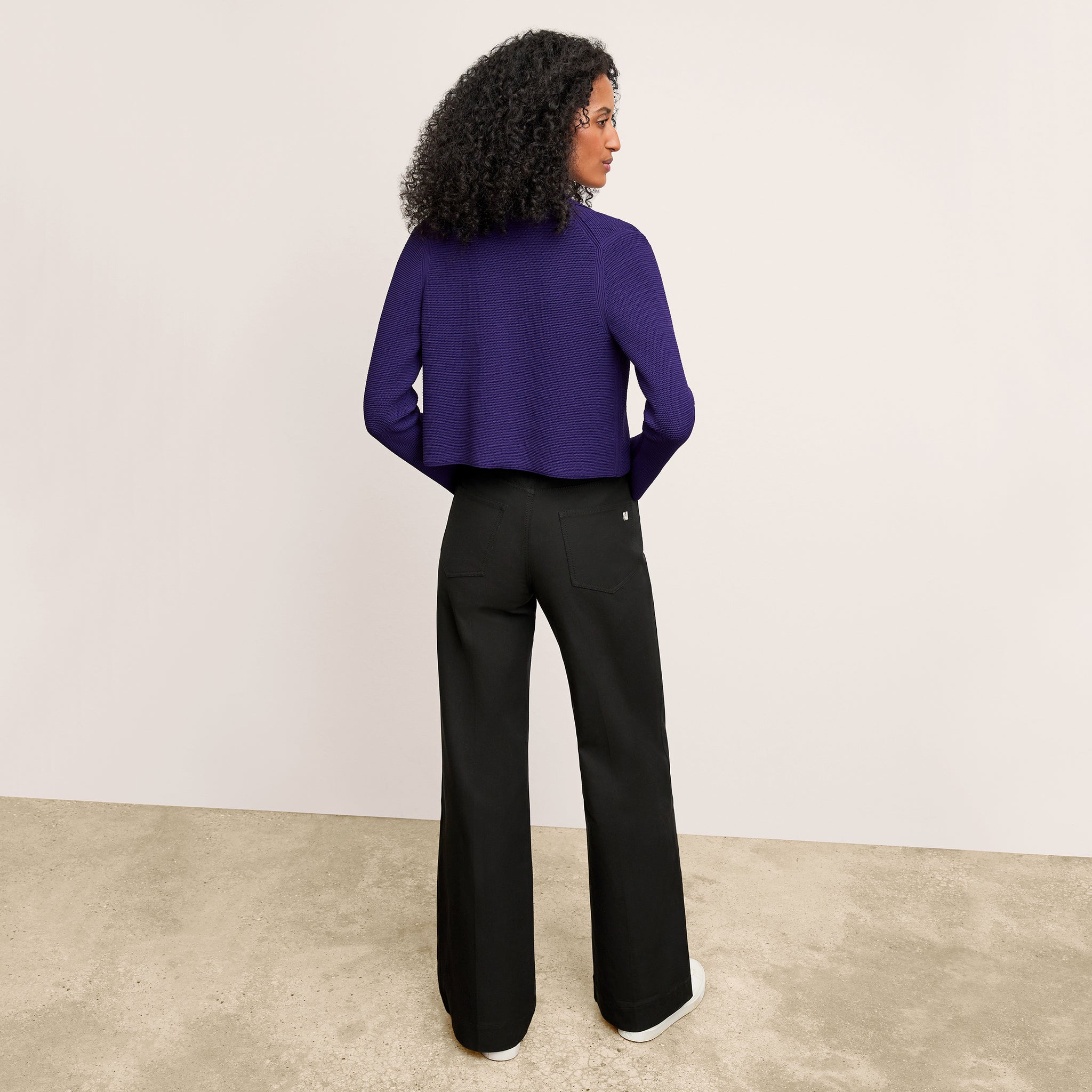 Front image of a woman wearing the Milo Jean in Black