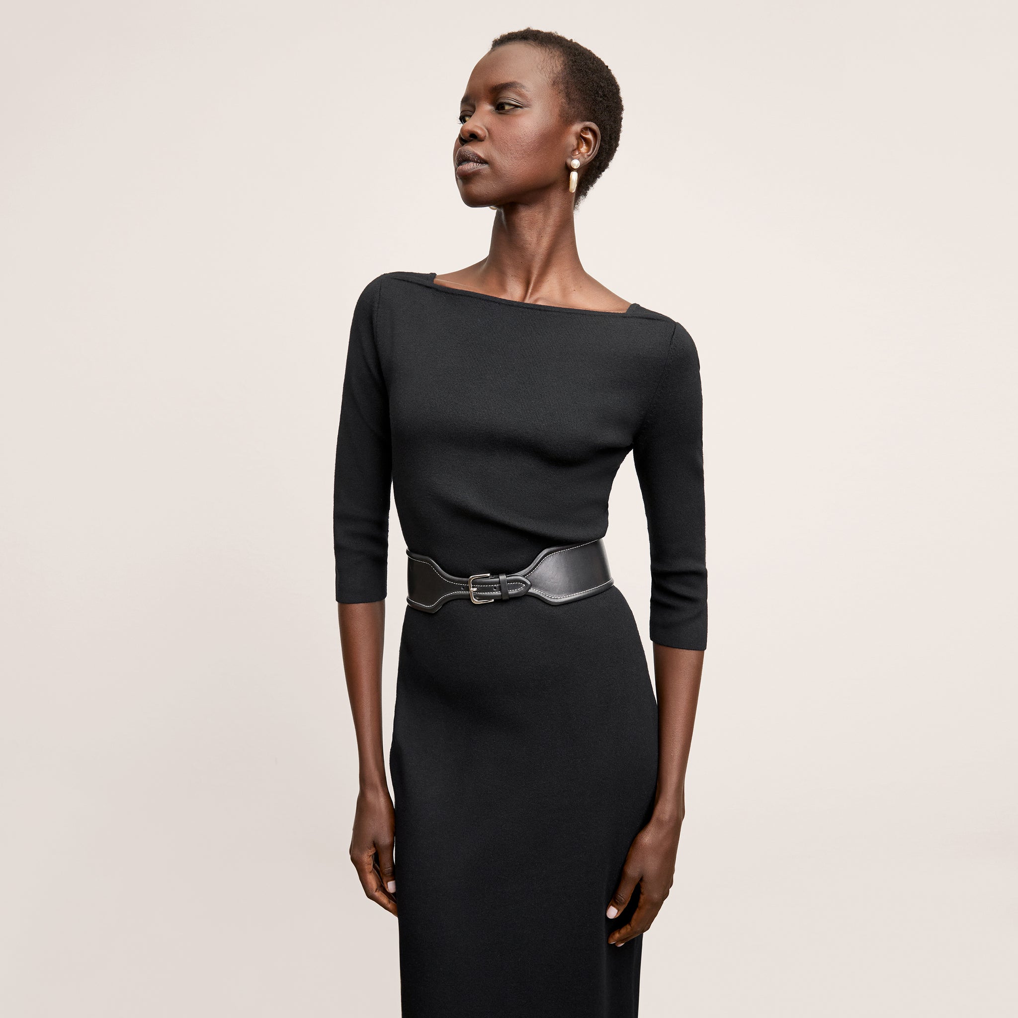 Front image of a woman wearing the Zana Dress in Black