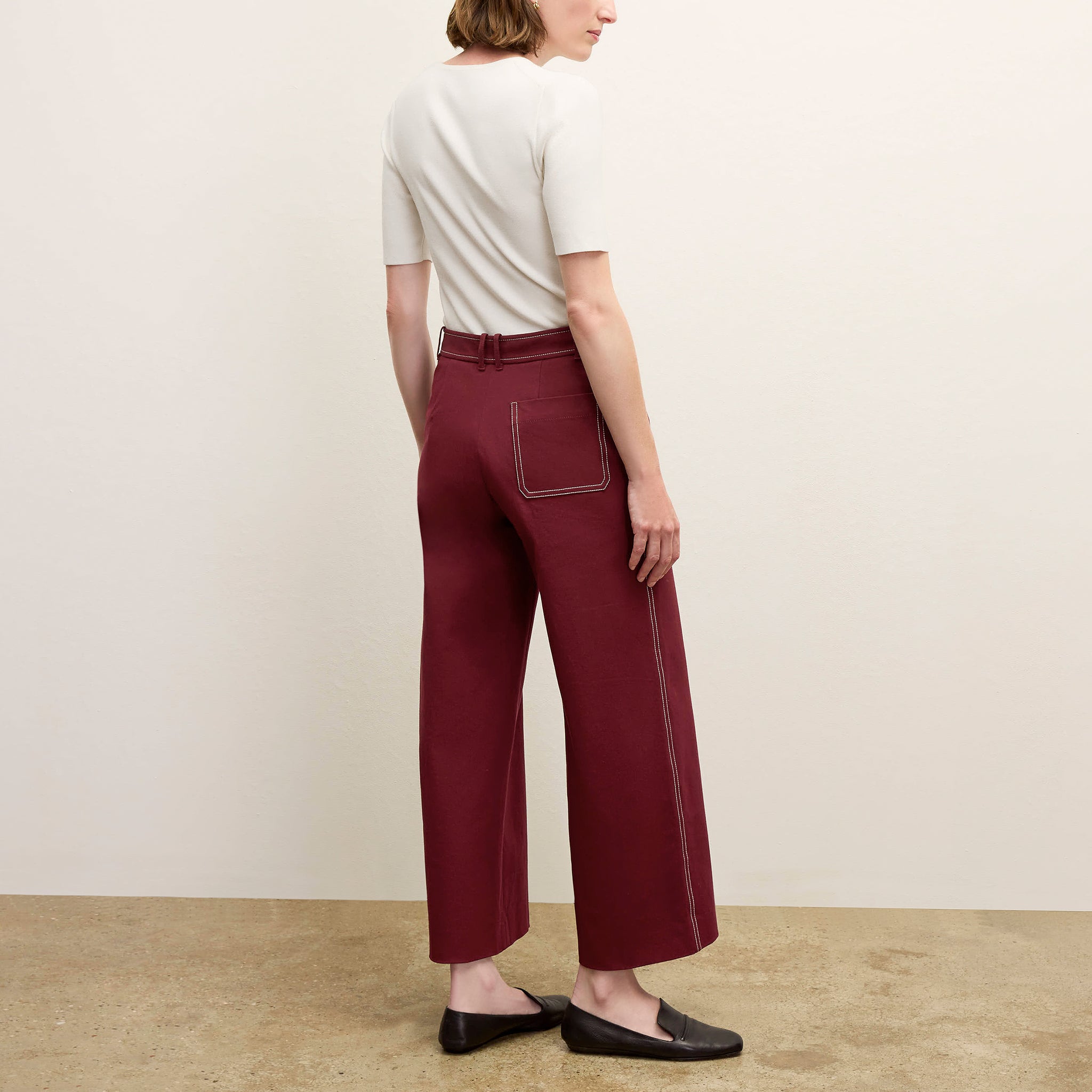 back image of a woman wearing the abby pant in berry jam 